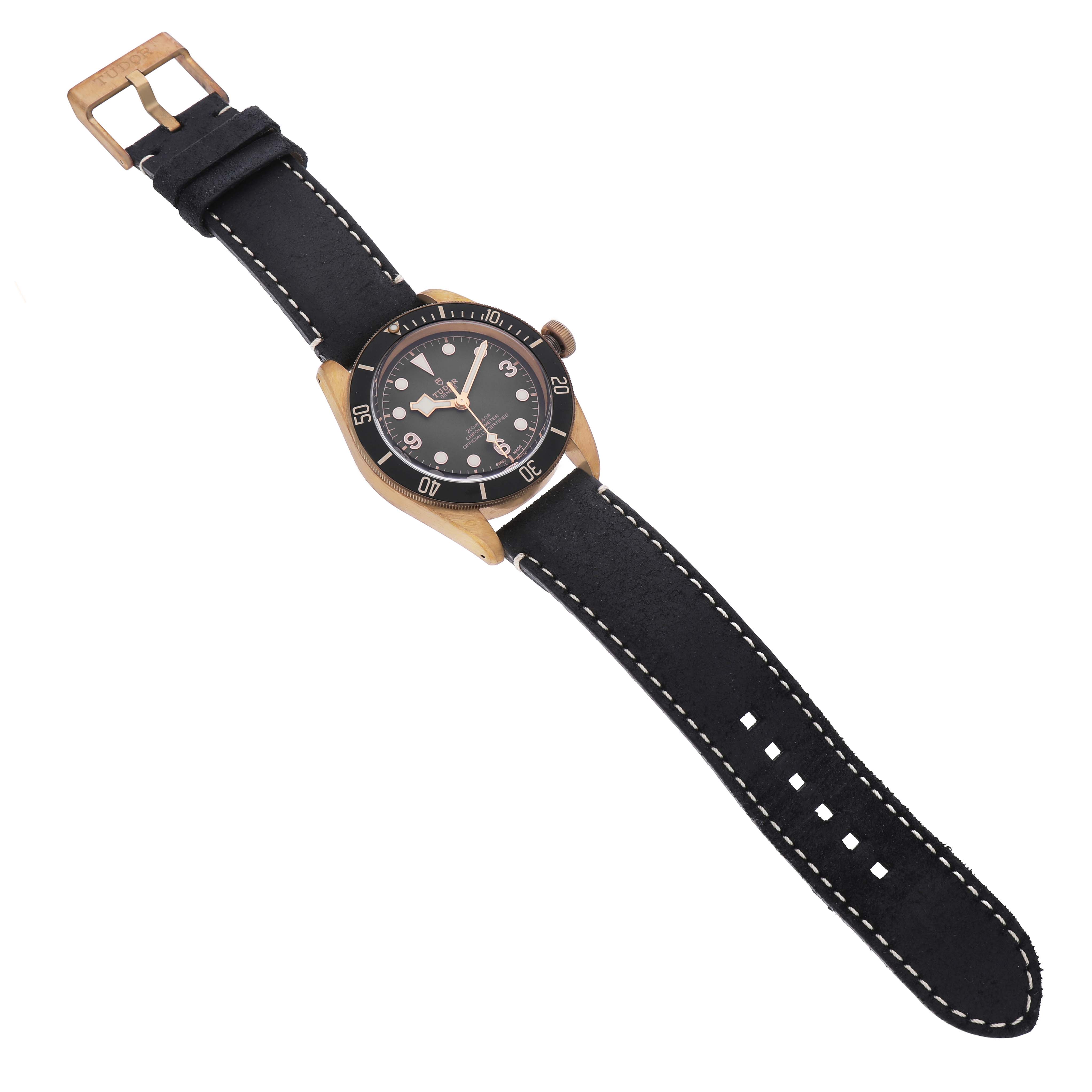 The Tudor Heritage Black Bay 79250BA Men's Bronze Grey Dial is shown at a slightly angled top view, highlighting the dial, case, crown, and strap.