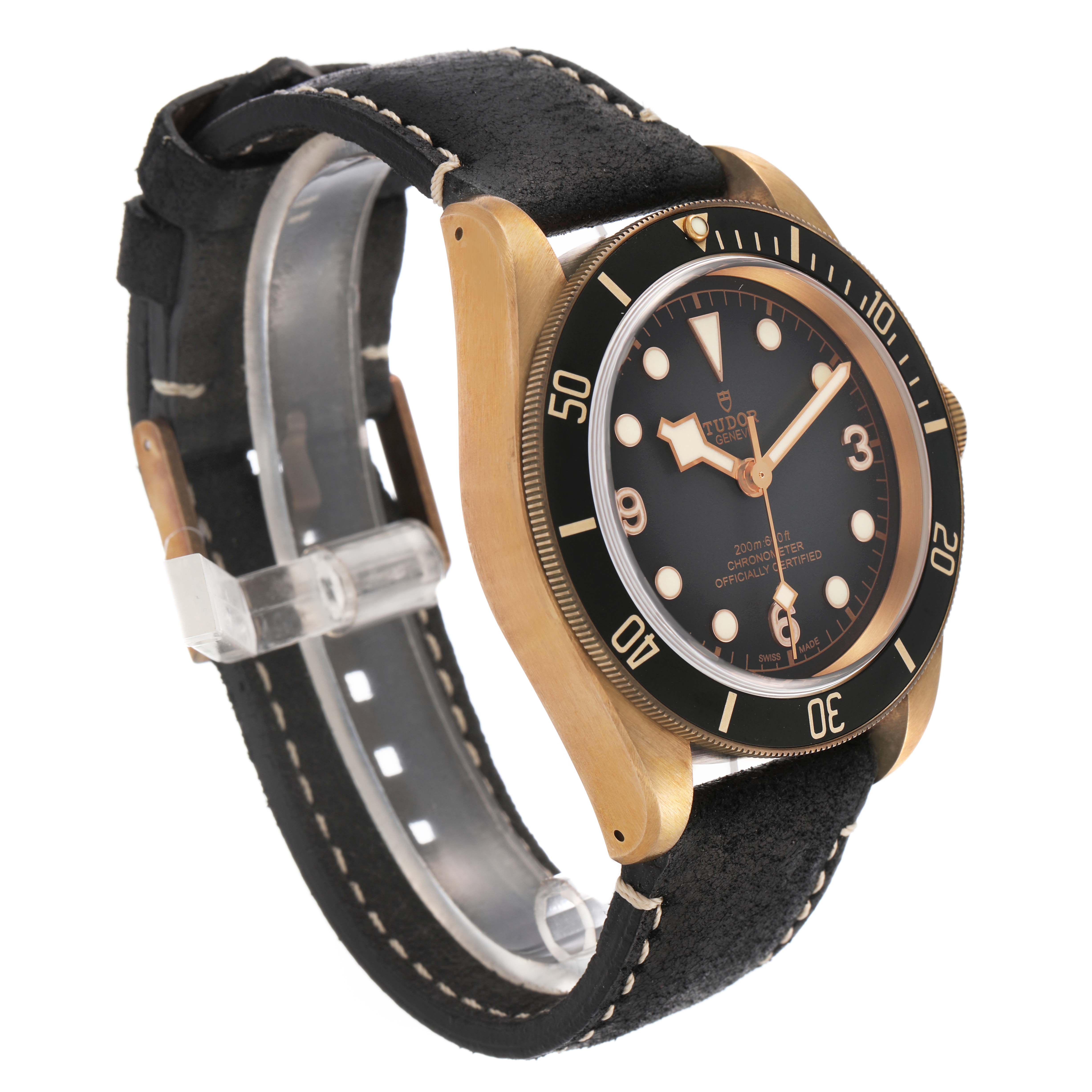 The Tudor Heritage Black Bay 79250BA Men's Bronze Grey Dial watch is shown at an angle highlighting the bezel, dial, and side of the case with a leather strap.