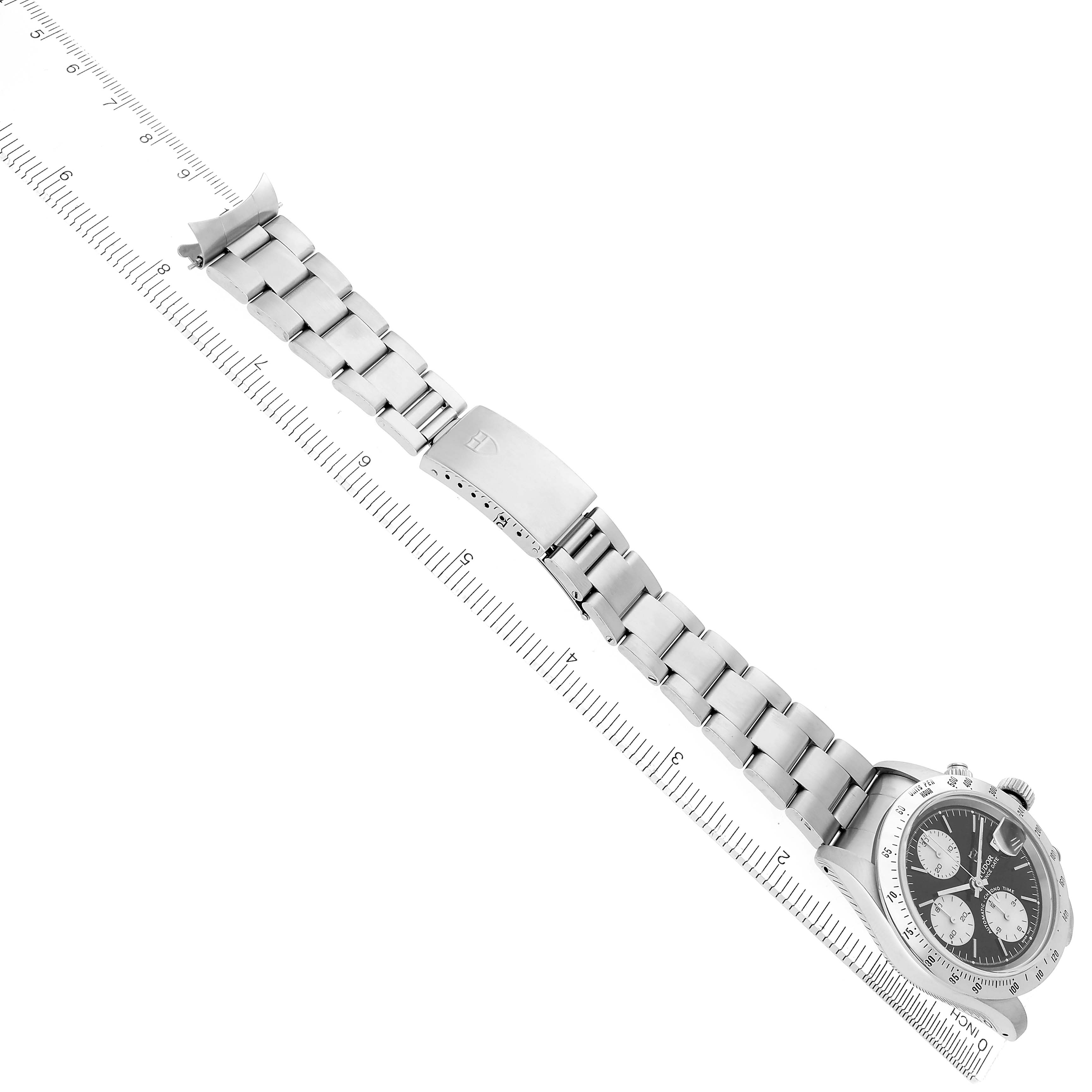 The Tudor Tiger 79280 Mens Stainless Steel Black Dial model watch is viewed from above, showing the face, bezel, metal bracelet, and clasp.