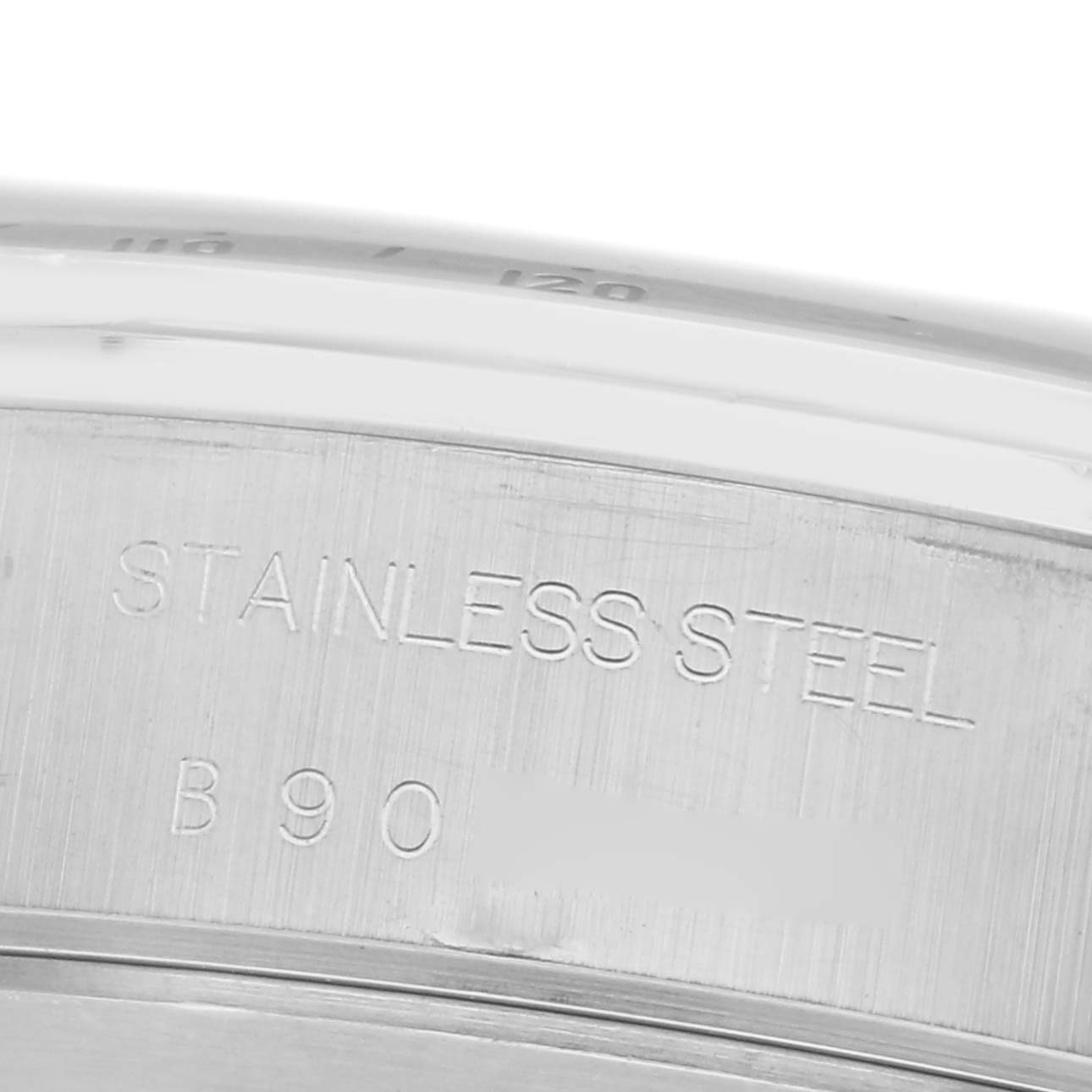 The image shows a close-up of the stainless steel back of a Tudor Tiger 79280 Mens Stainless Steel Black Dial model watch, highlighting the engraved text.
