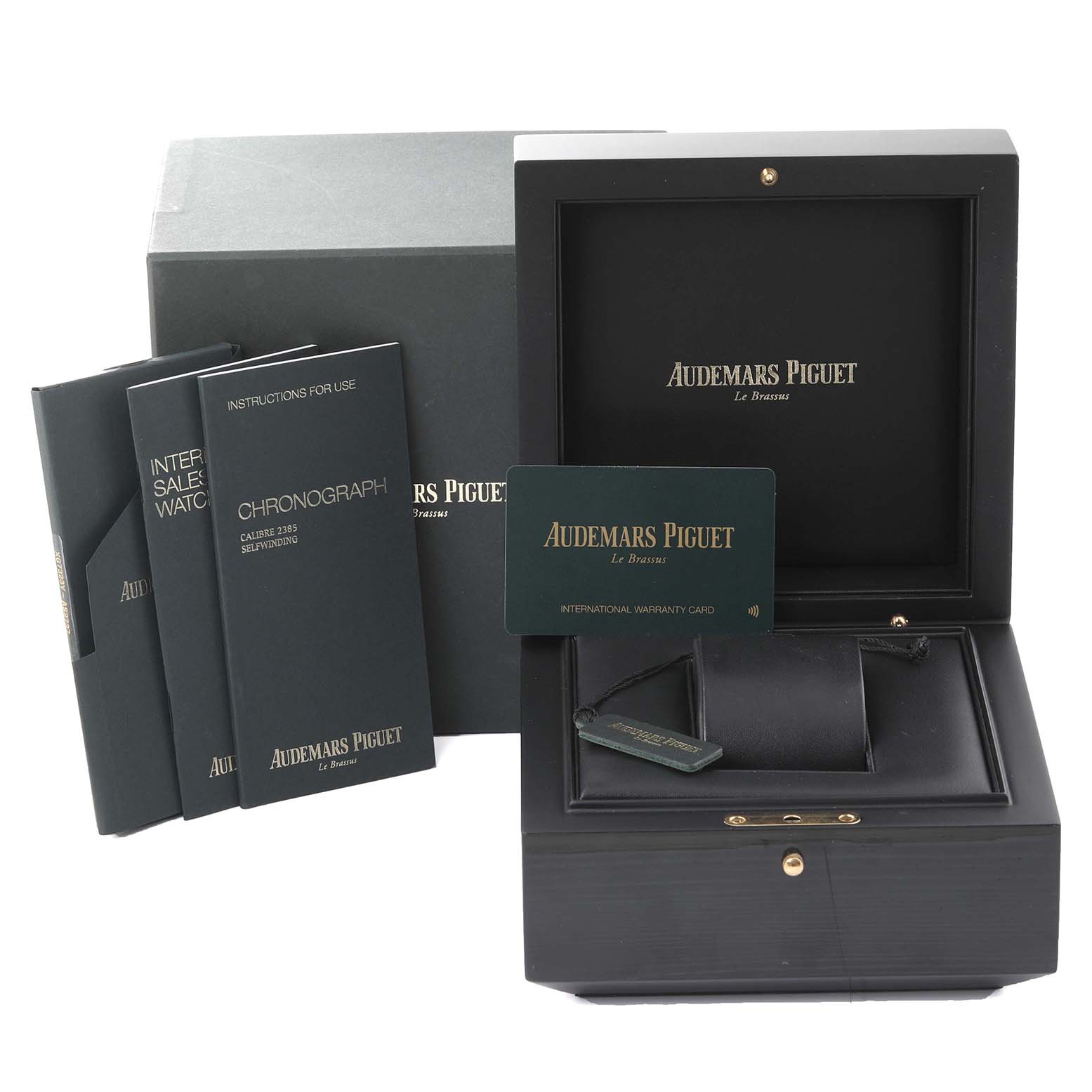 The image shows the packaging, warranty card, and manuals for an Audemars Piguet Royal Oak 26315ST.OO.1256ST.02 Men's Stainless Steel Silver Dial 26315ST.OO.1256ST.02 Men's Stainless Steel Silver Dial watch.