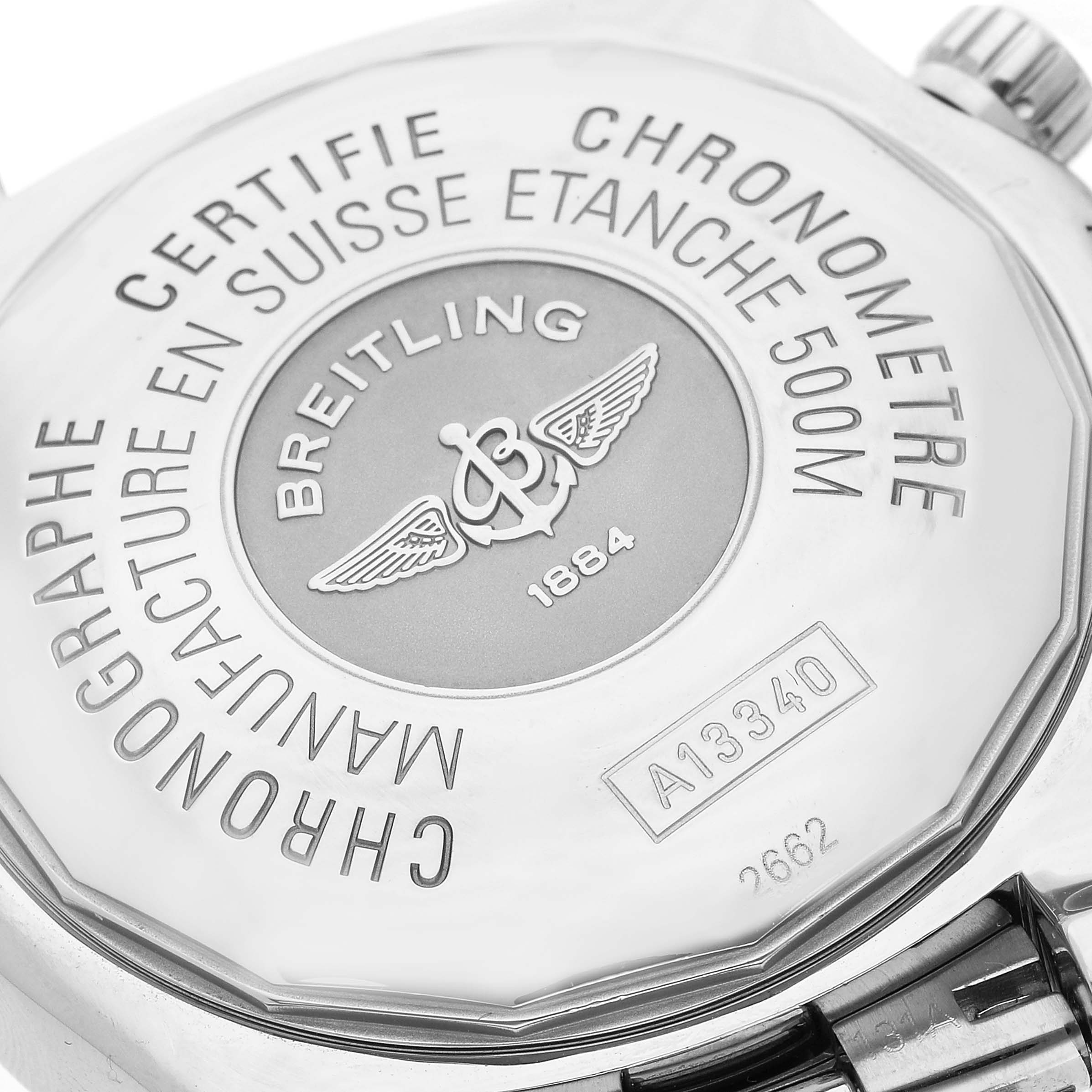 The image shows the back case of the Breitling Superocean A13340 Men's Stainless Steel Silver Dial A13340 Men's Stainless Steel Silver Dial watch, featuring its engraved details and branding.