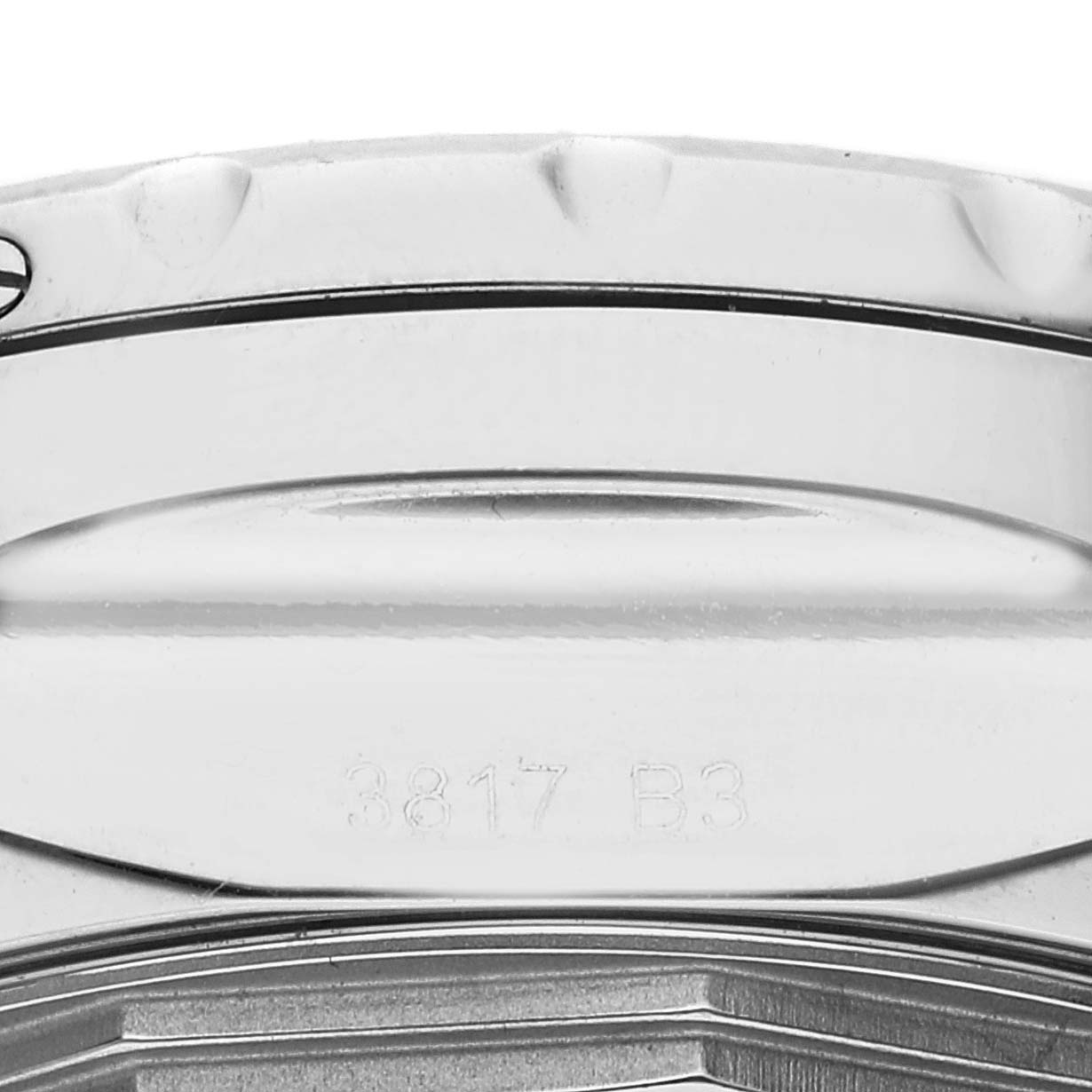 The image shows an angled close-up of the rim and part of the back casing of a Breitling Bentley A13362 Men's Stainless Steel Mother of Pearl Dial A13362 Men's Stainless Steel Mother of Pearl Dial watch.