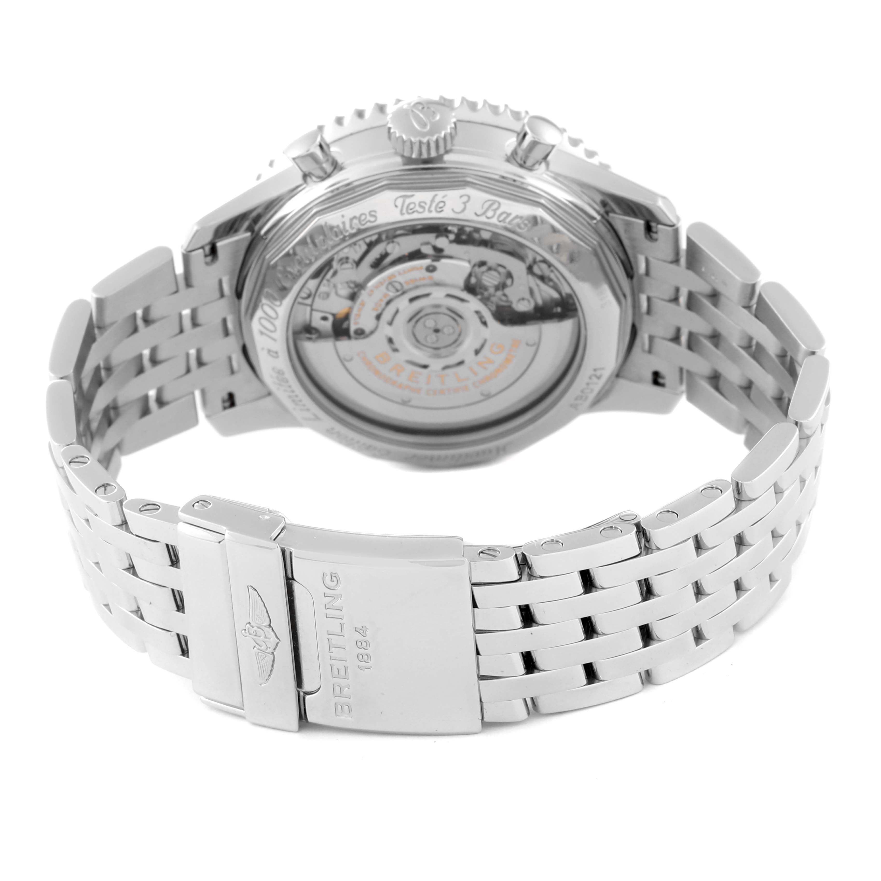 The image shows the back view of a Breitling Limited Series watch, displaying its movement and stainless steel bracelet.