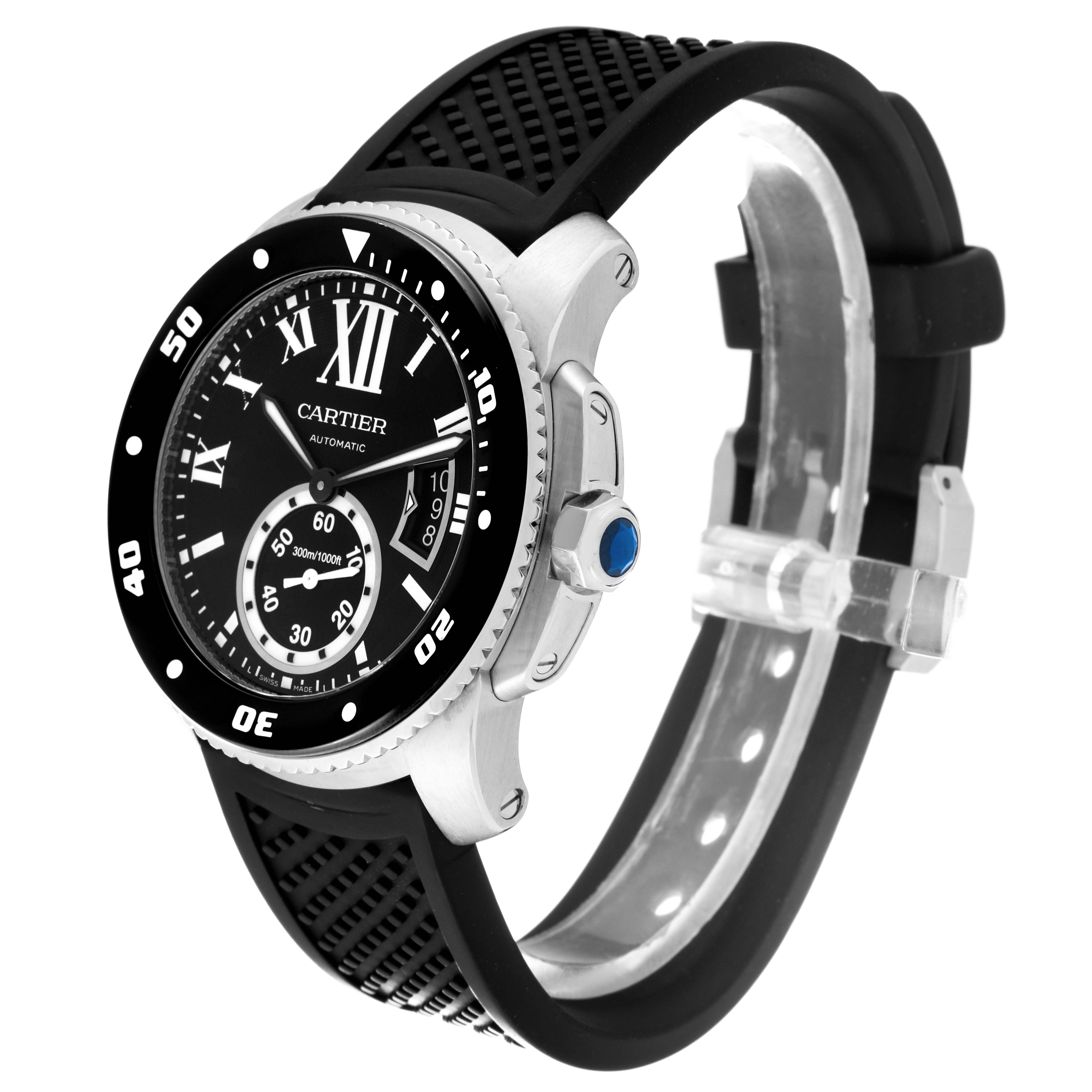 The image shows a Calibre de Cartier watch by Cartier at an angled side view, highlighting its black rubber strap and black watch face with silver details.
