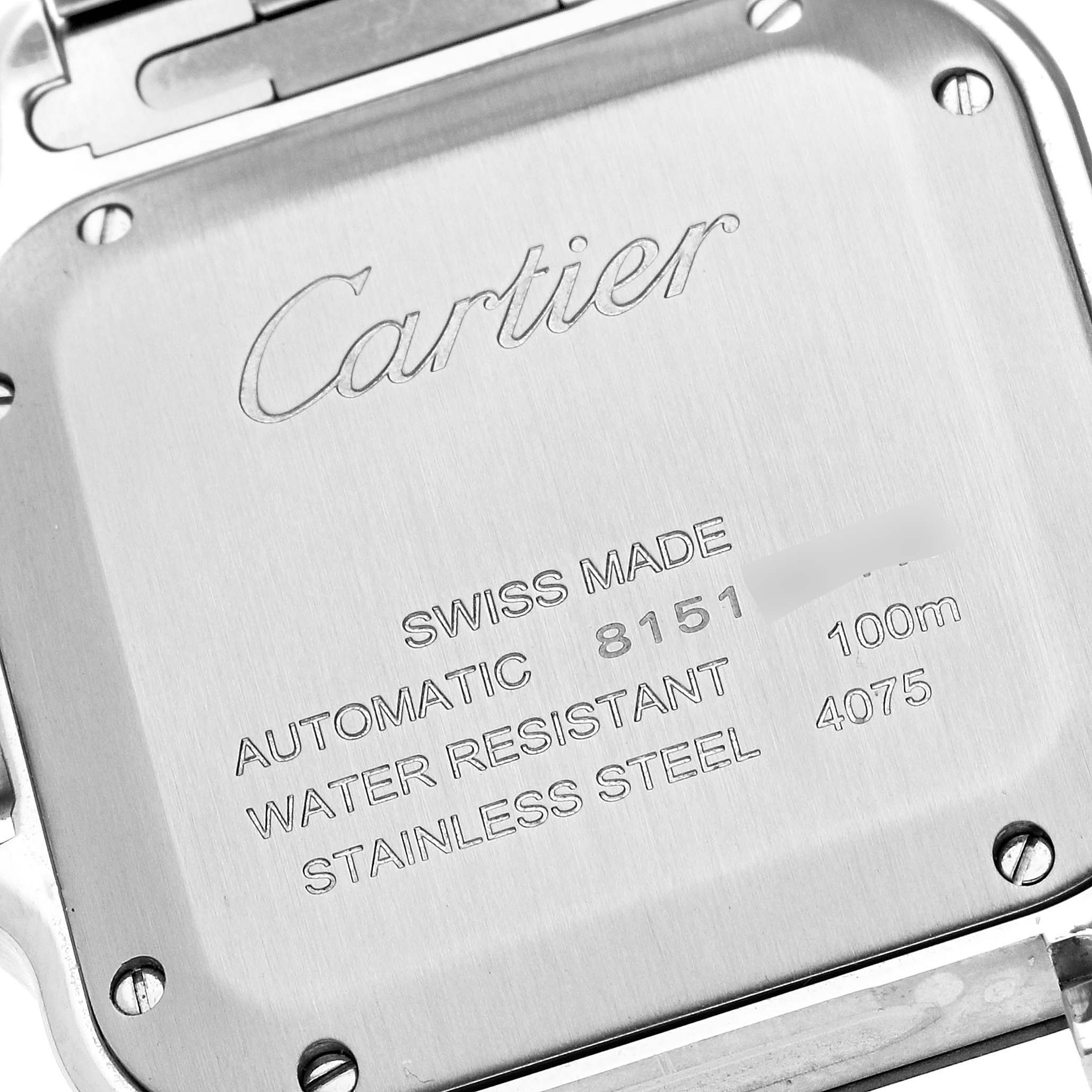This image shows the back case of a Santos model by Cartier, revealing brand engravings and specifications.