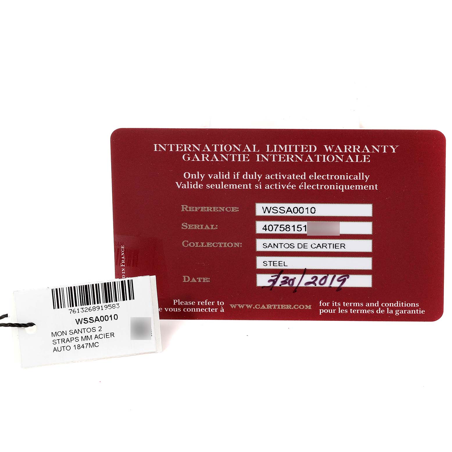 This image shows the International Limited Warranty card and model tag for a Santos de Cartier watch.