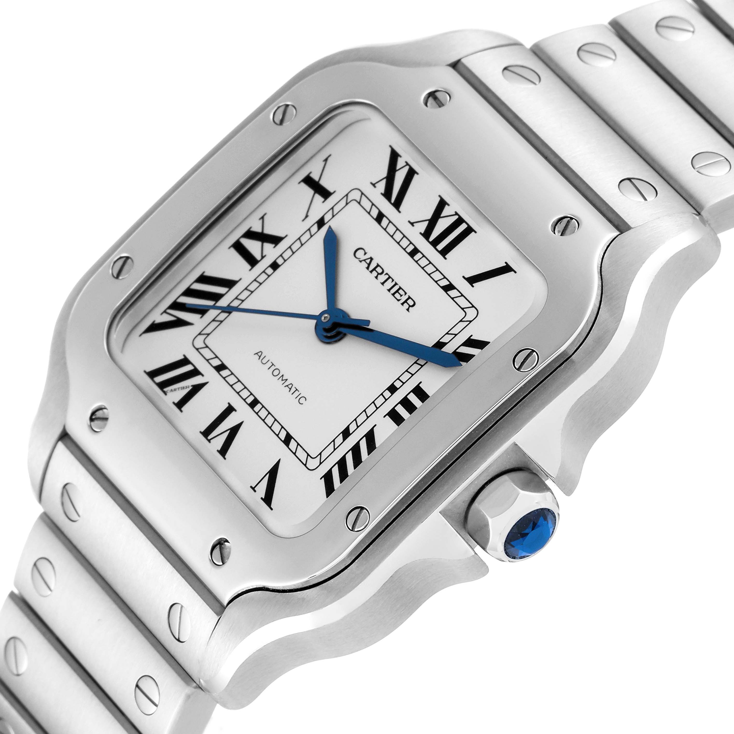 The image shows a close-up angle of the Cartier Santos WSSA0010 Men's Stainless Steel Silver Dial WSSA0010 Men's Stainless Steel Silver Dial watch, focusing on the face, bezel, and part of the bracelet.