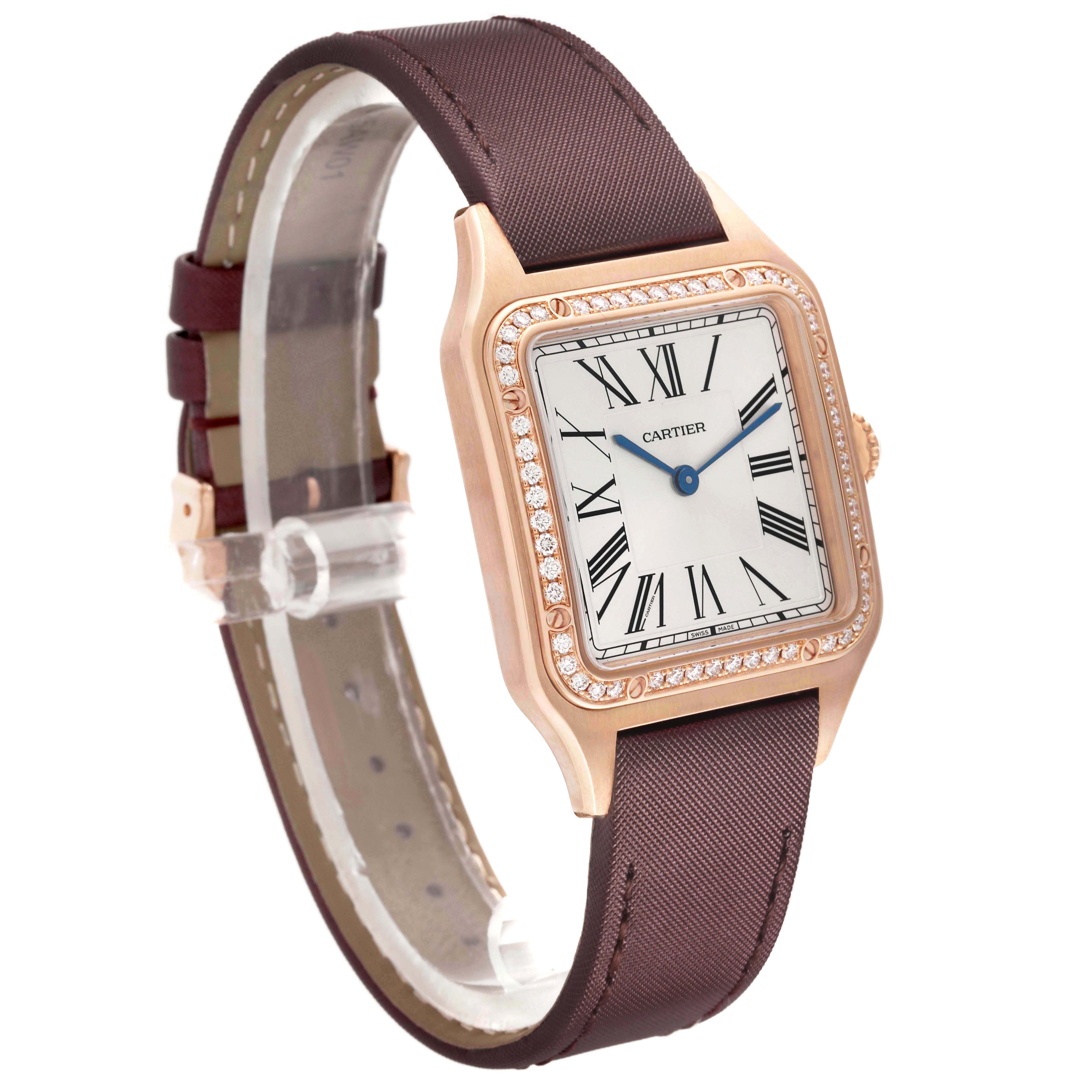 The Cartier Santos Dumont WJSA0018 Men's Rose Gold Silver Dial watch is shown at an oblique angle, highlighting the face, bezel, and brown strap.
