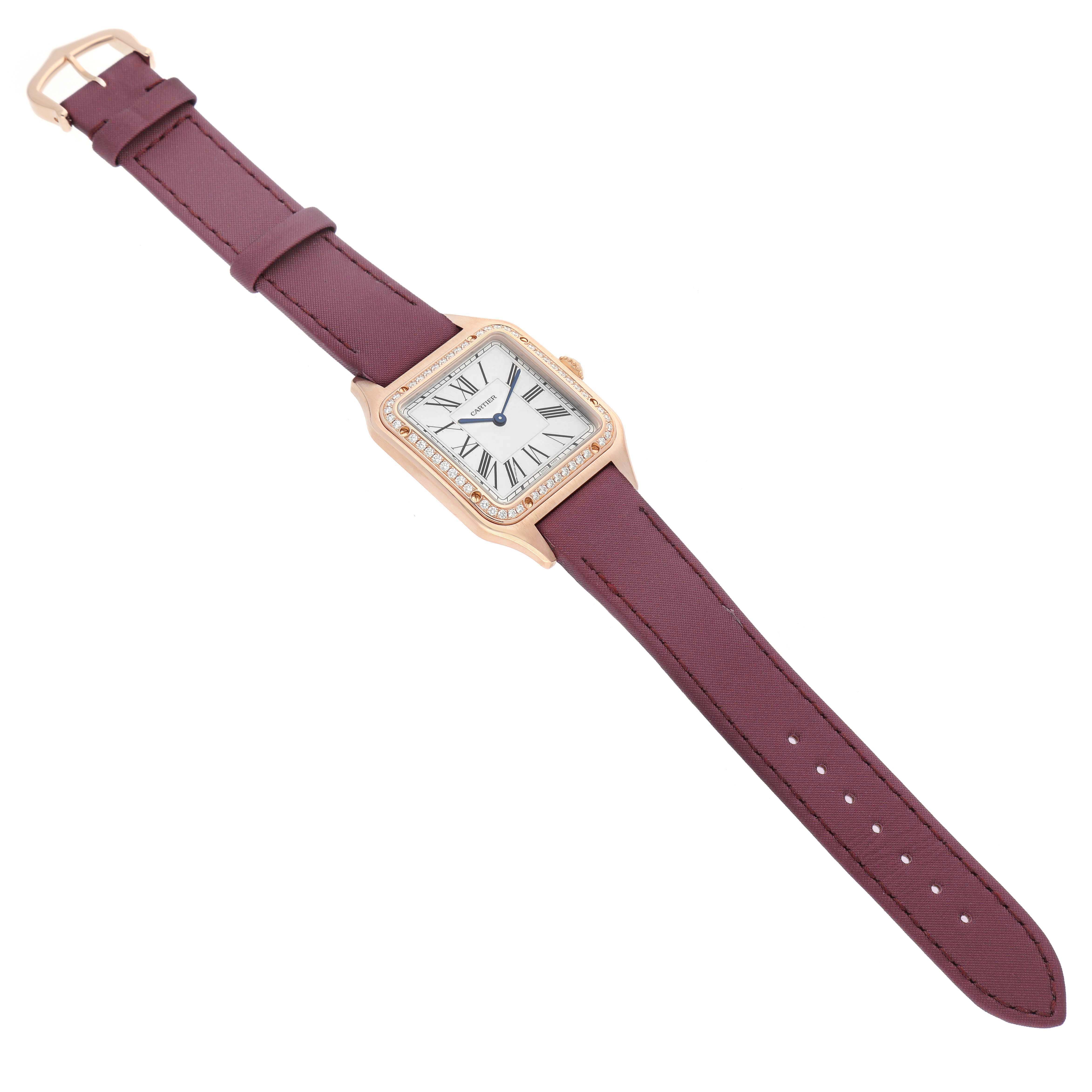 The Cartier Santos Dumont WJSA0018 Men's Rose Gold Silver Dial watch is shown from a top-down angle, displaying the face, case, and full strap.
