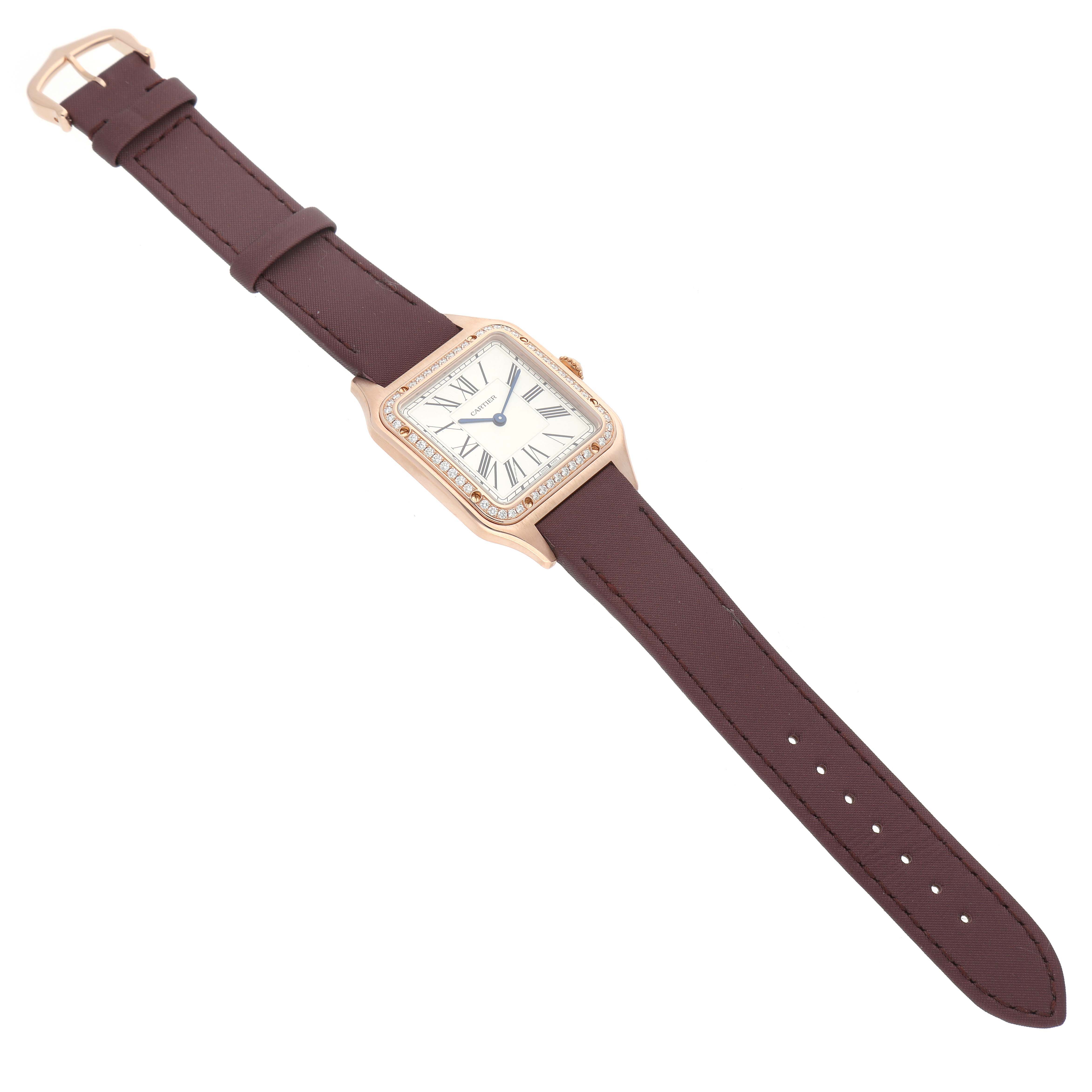 This image shows a Cartier Santos Dumont WJSA0018 Men's Rose Gold Silver Dial WJSA0018 Men's Rose Gold Silver Dial watch at a slight angle, featuring the dial, case, and full leather strap.
