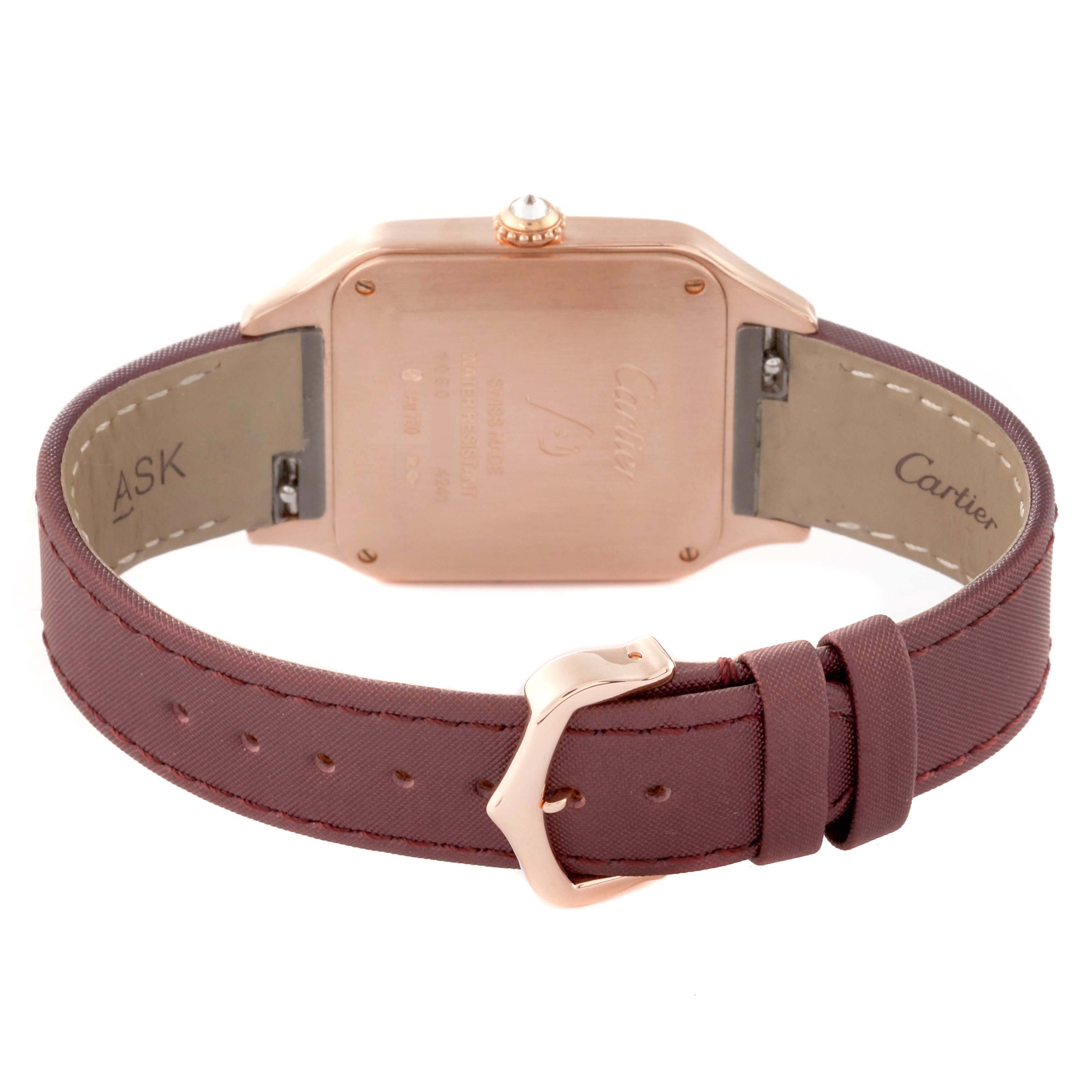 The image shows the back of a Cartier Santos Dumont WJSA0018 Men's Rose Gold Silver Dial WJSA0018 Men's Rose Gold Silver Dial watch, featuring its caseback, crown, and leather strap with buckle.