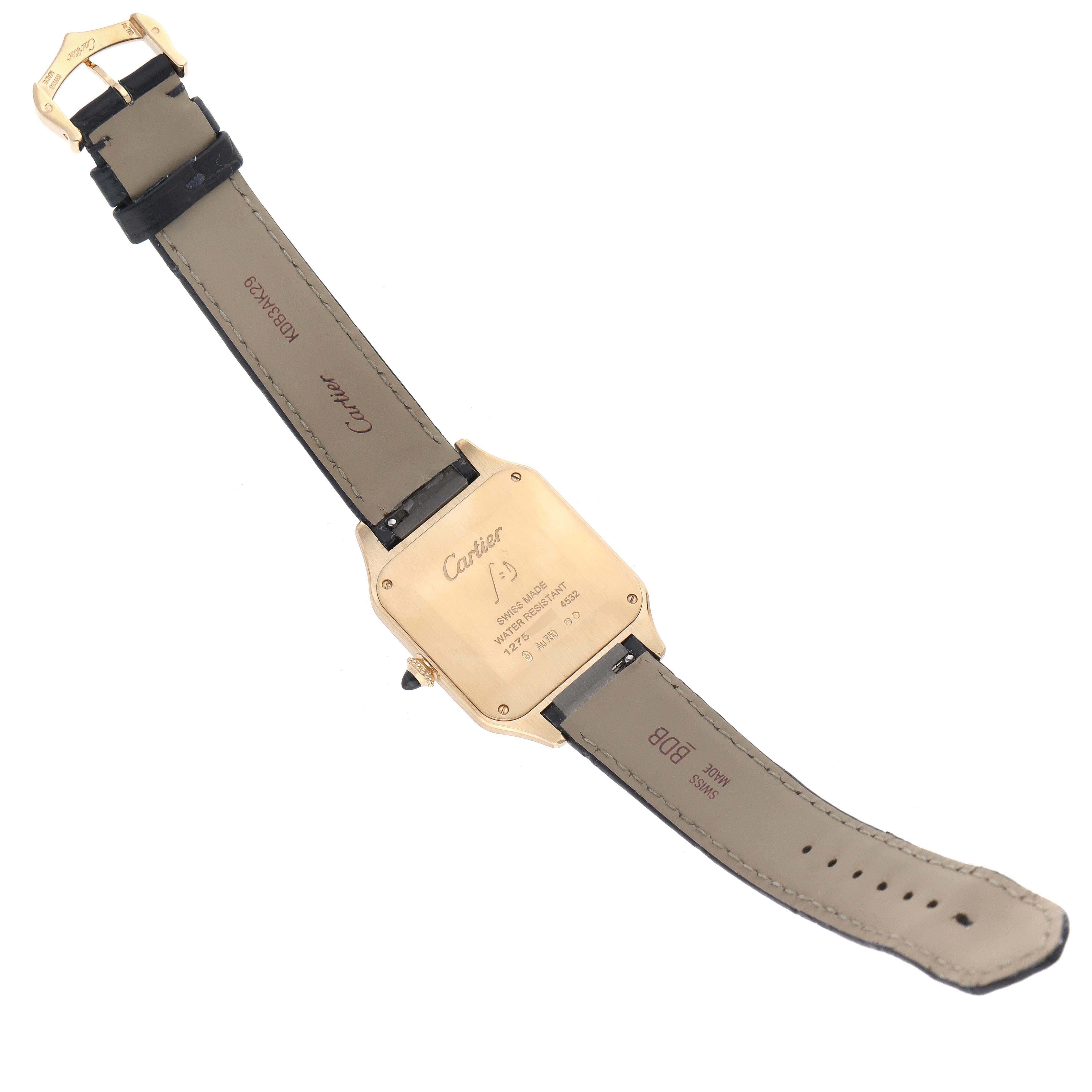 The image shows the back view of a Santos Dumont watch by Cartier, highlighting the case back and strap.