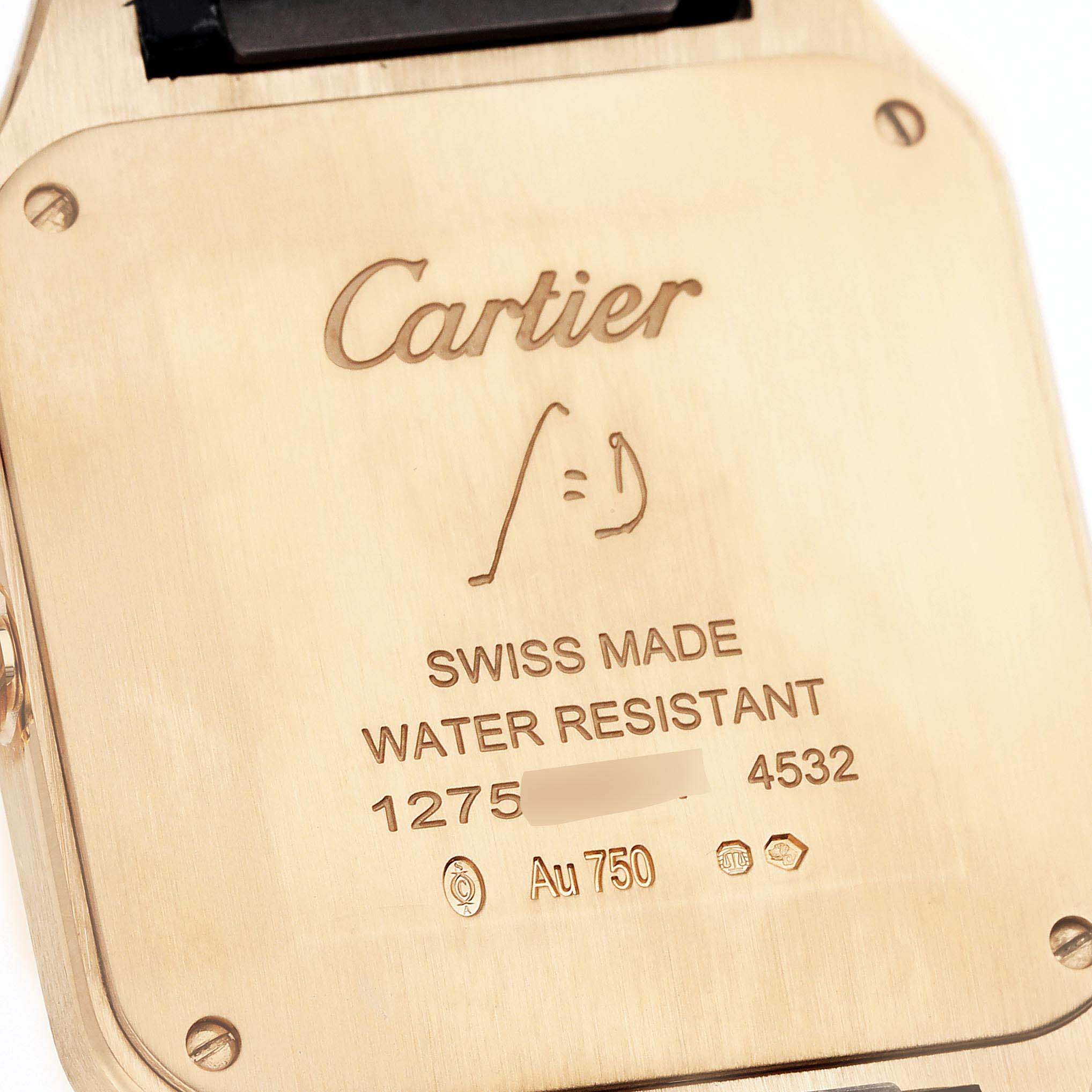 The image shows the back casing of a Santos Dumont watch by Cartier, displaying the brand name and specifications.