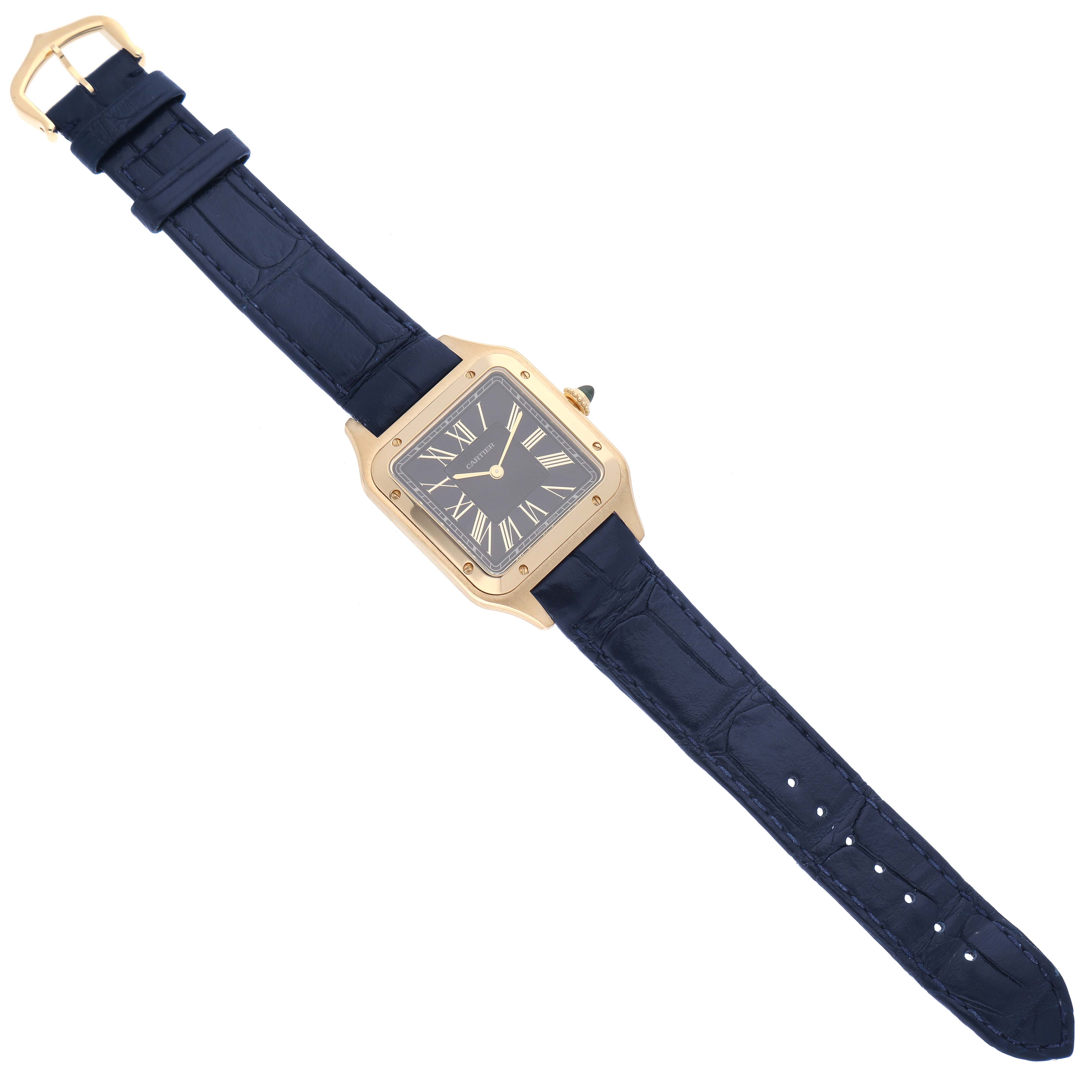 The image shows a top-down view of a Cartier Santos Dumont WGSA0077 Men's Yellow Gold Blue Dial WGSA0077 Men's Yellow Gold Blue Dial watch, displaying the face, strap, and buckle.