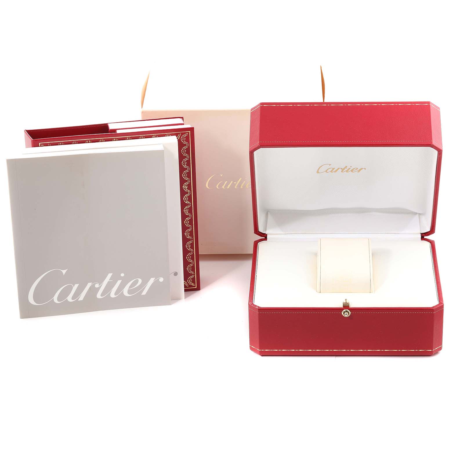 A Cartier Tank Française watch box, additional packaging, and user manuals are shown in an organized display.