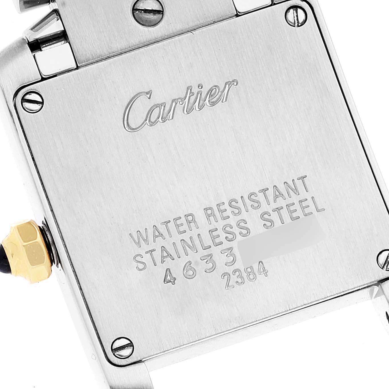 This image shows the back case of a Cartier Tank Française watch, highlighting the brand engraving and material information.