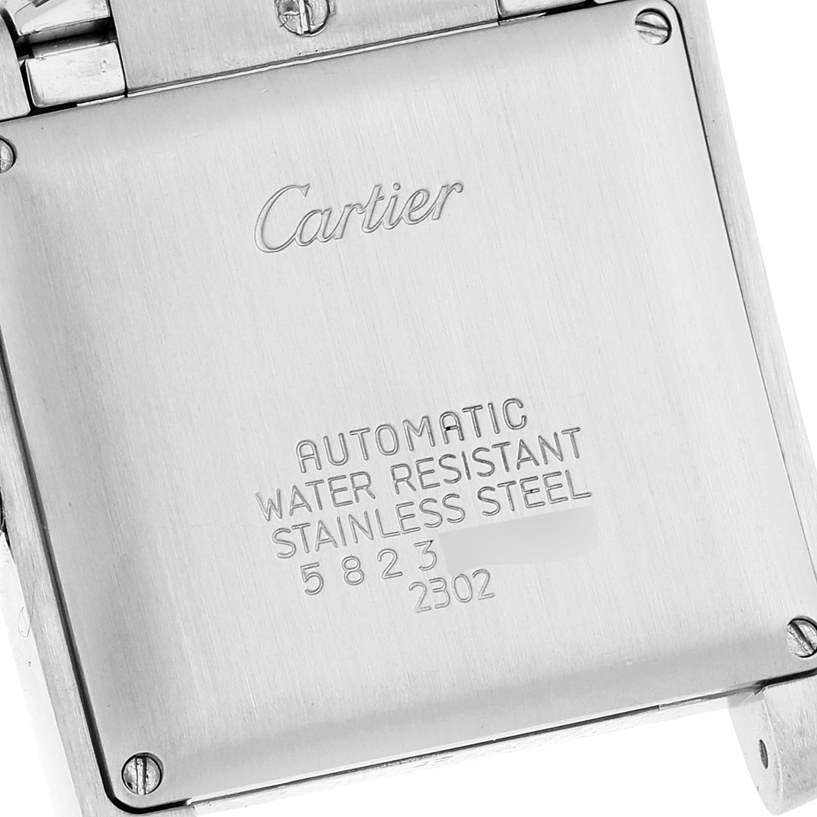 The image shows the back case of a Cartier Tank Francaise W51005Q4 Men's Steel and Gold (two tone) Silver Dial W51005Q4 Men's Steel and Gold (two tone) Silver Dial watch, highlighting its engravings and screws.