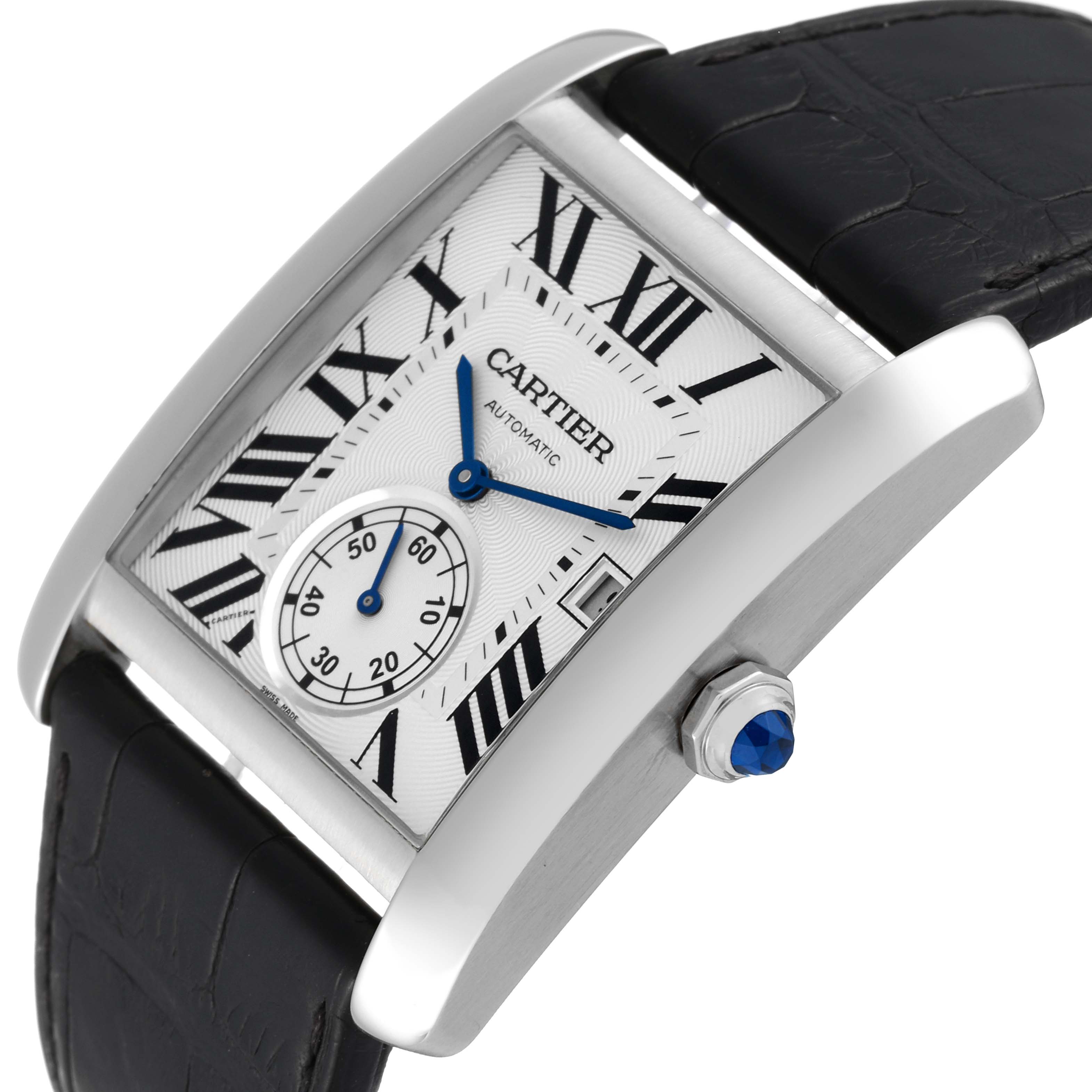 The image shows a Cartier Tank MC W5330003 Men
s Stainless Steel Silver Dial W5330003 Men
s Stainless Steel Silver Dial watch from an oblique angle, highlighting the dial, case, strap, and crown with a blue gem.