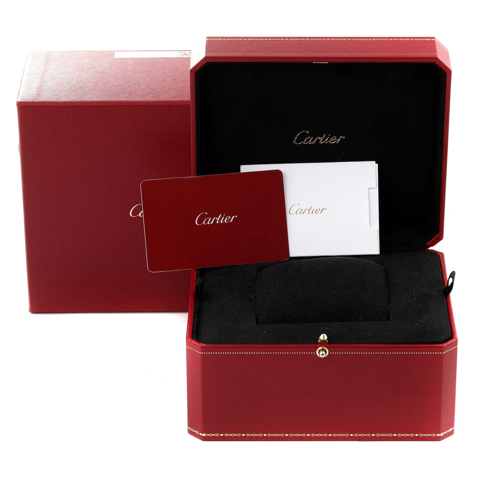 The image shows the packaging and accessories for a Cartier Tank Must WSTA0052 Women's Stainless Steel Silver Dial WSTA0052 Women's Stainless Steel Silver Dial watch, including a red box, a cushion, and booklets.