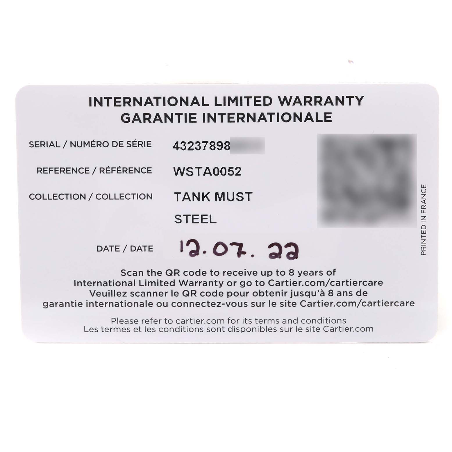 This image shows an International Limited Warranty card for the Tank Must model by Cartier.