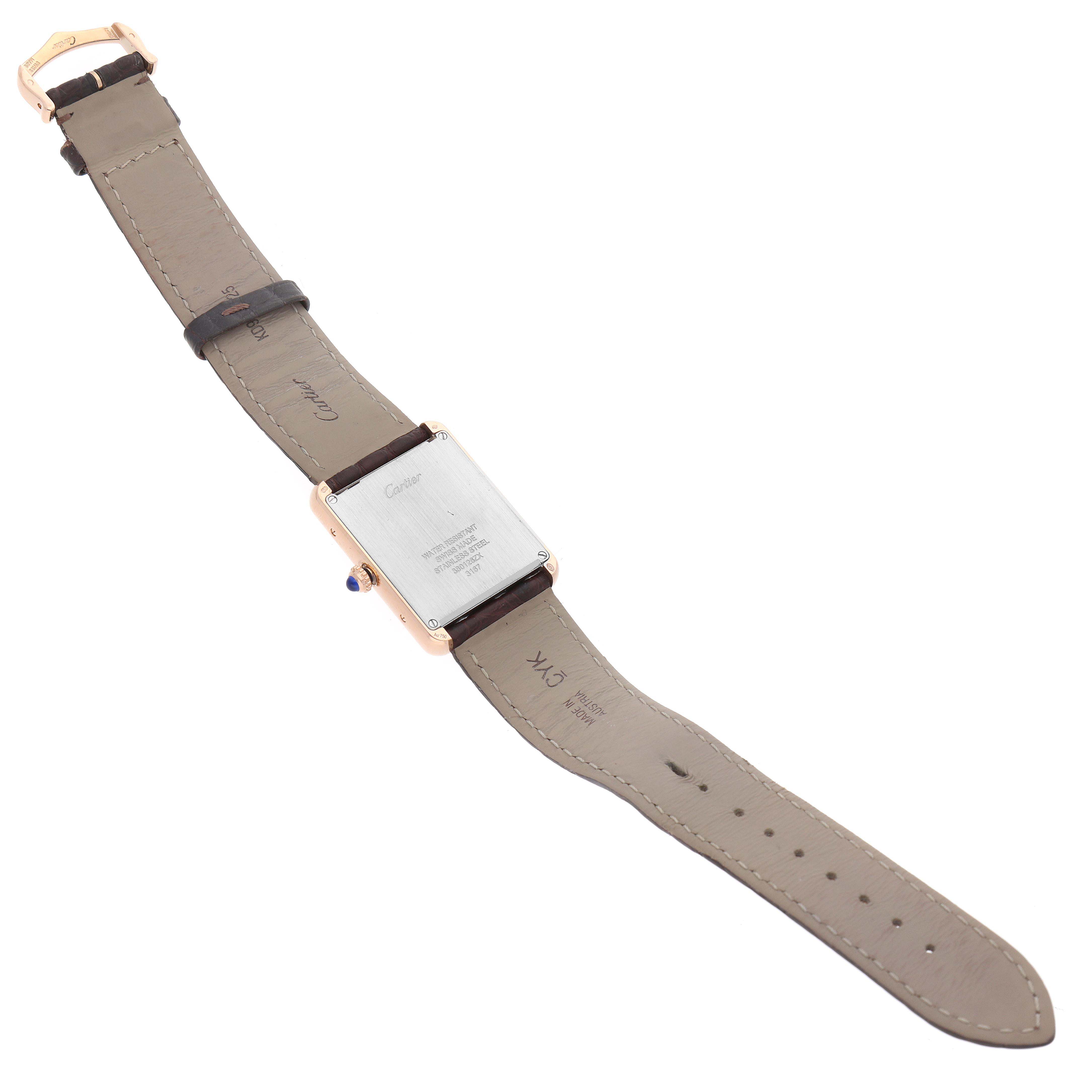 This image shows the back and strap of the Cartier Tank Solo W5200025 Men's Steel and Gold (two tone) Silver Dial W5200025 Men's Steel and Gold (two tone) Silver Dial watch laid flat, highlighting the rear casing and leather band.