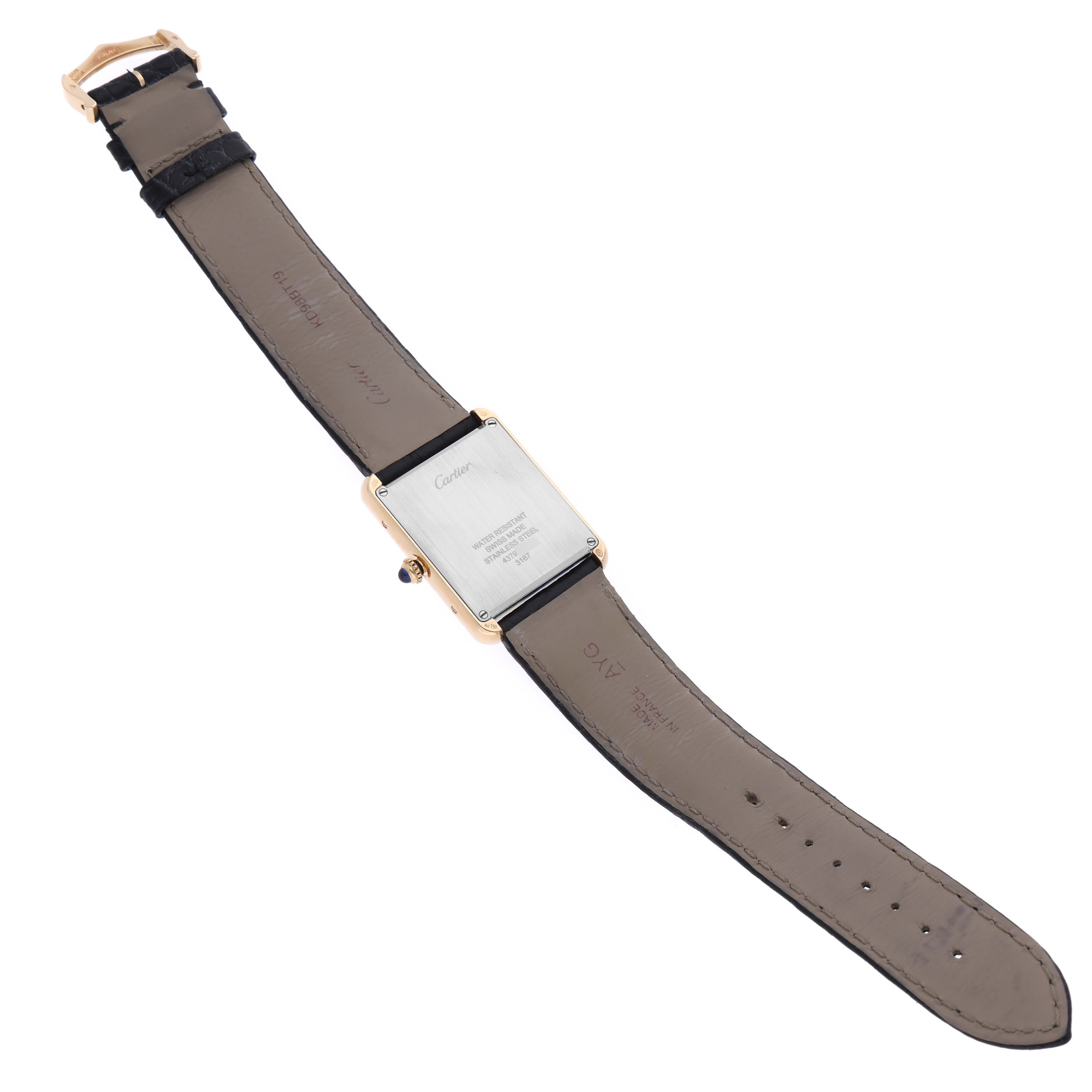 This image shows the back of the Cartier Tank Solo W5200004 Men's Yellow Gold Silver Dial W5200004 Men's Yellow Gold Silver Dial watch, highlighting its case back and leather strap.