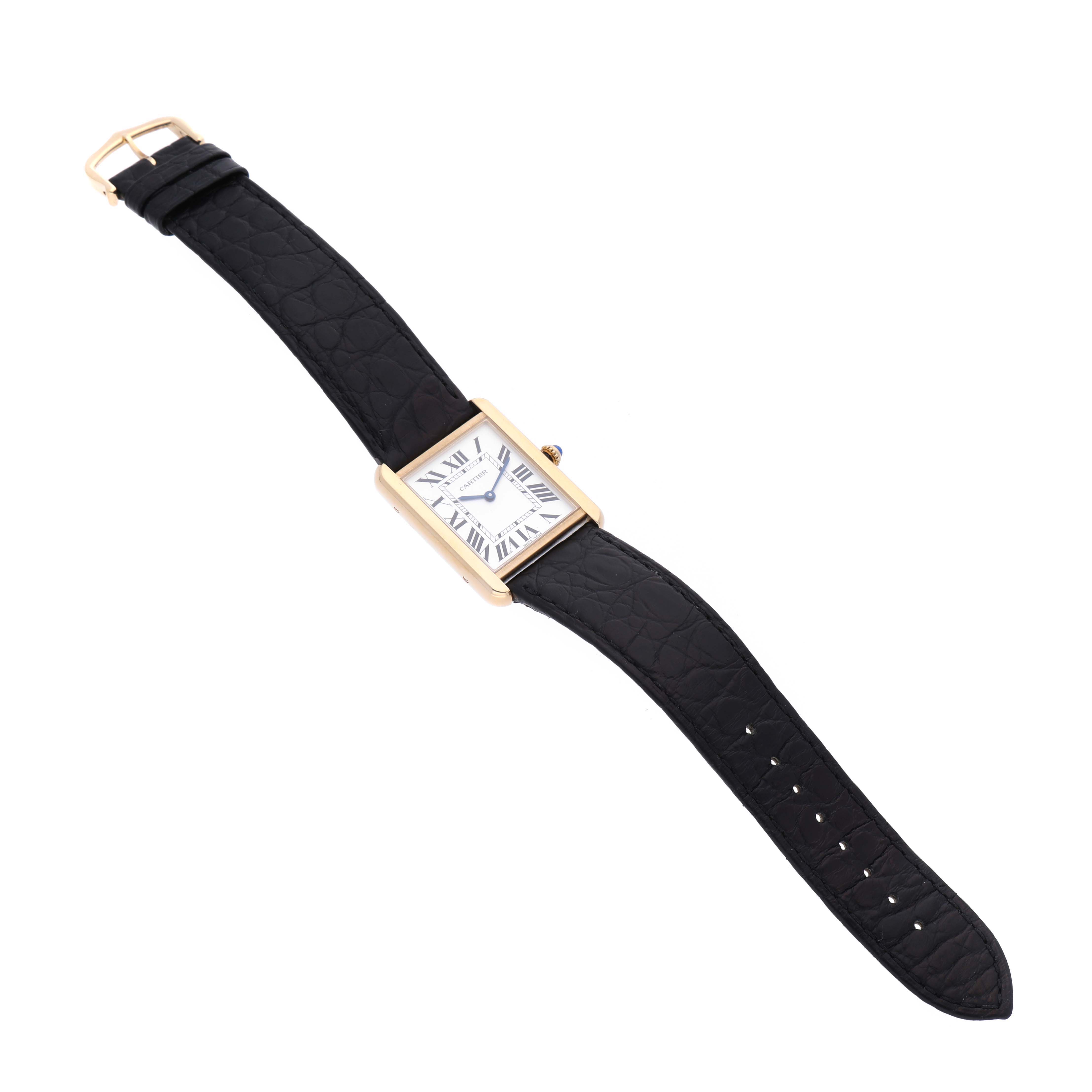 This image shows a Cartier Tank Solo W5200004 Men's Yellow Gold Silver Dial W5200004 Men's Yellow Gold Silver Dial watch at a slightly tilted angle, highlighting its gold rectangular case and black leather strap.