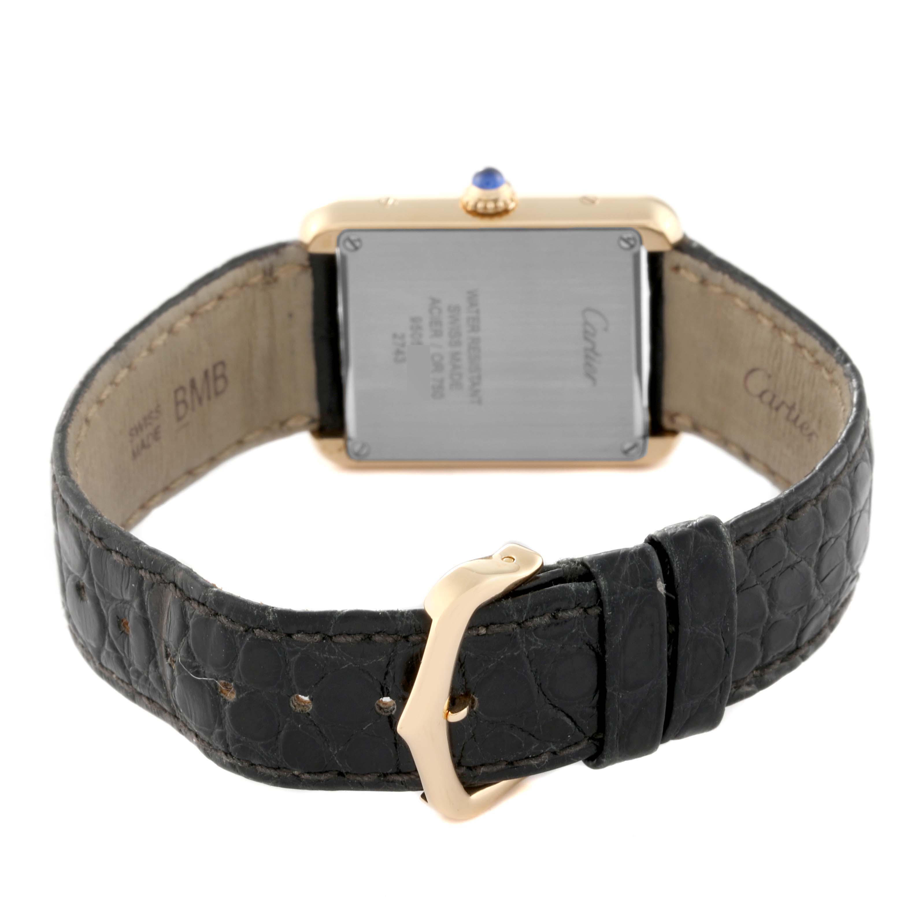 The image shows the back view of the Tank Solo model by Cartier, highlighting the case back, strap, and clasp.