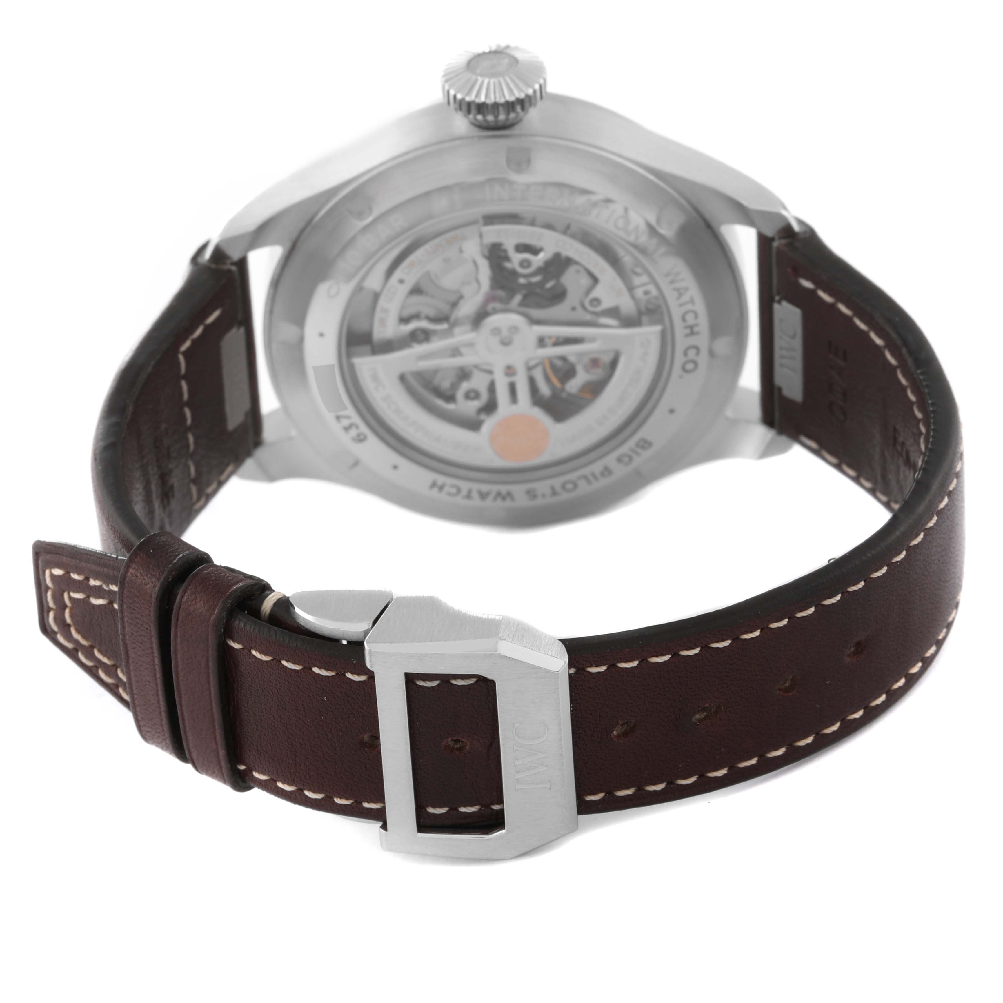 The image shows the back of an IWC Pilot IW329306 Men's Stainless Steel Green Dial IW329306 Men's Stainless Steel Green Dial model watch, highlighting its transparent case back and brown leather strap.