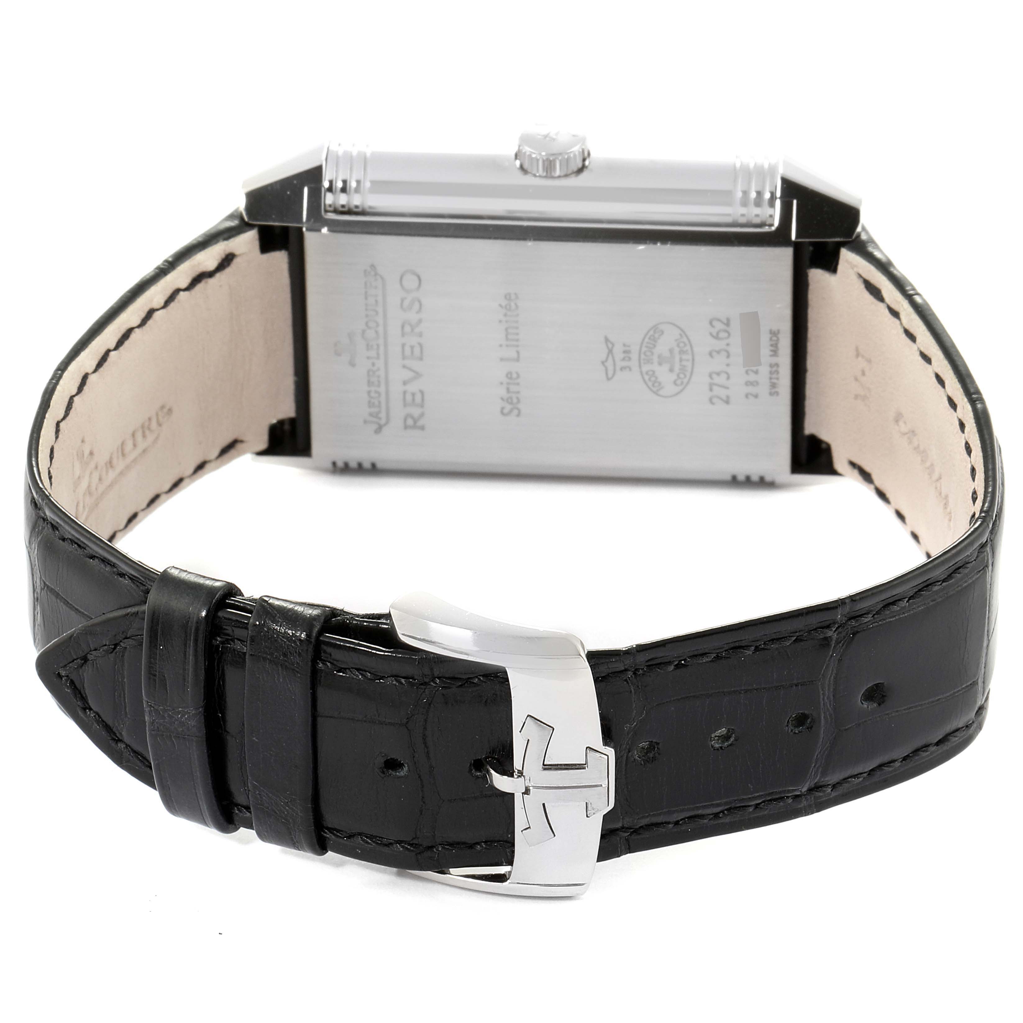 The image shows the back case and leather strap with buckle of the Jaeger-LeCoultre Reverso watch, including the model details.