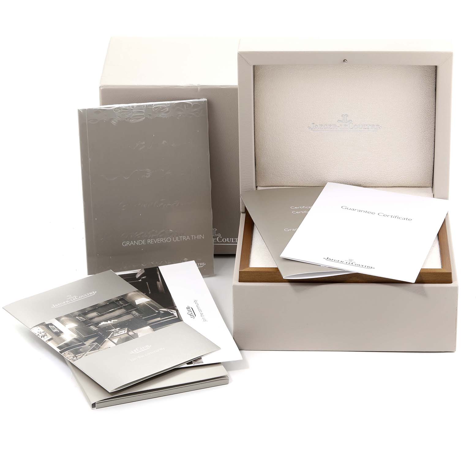 The image shows the packaging, manual, and warranty documents for a Jaeger LeCoultre Reverso Q33735E1 Men's White Gold Blue Dial Q33735E1 Men's White Gold Blue Dial model watch.