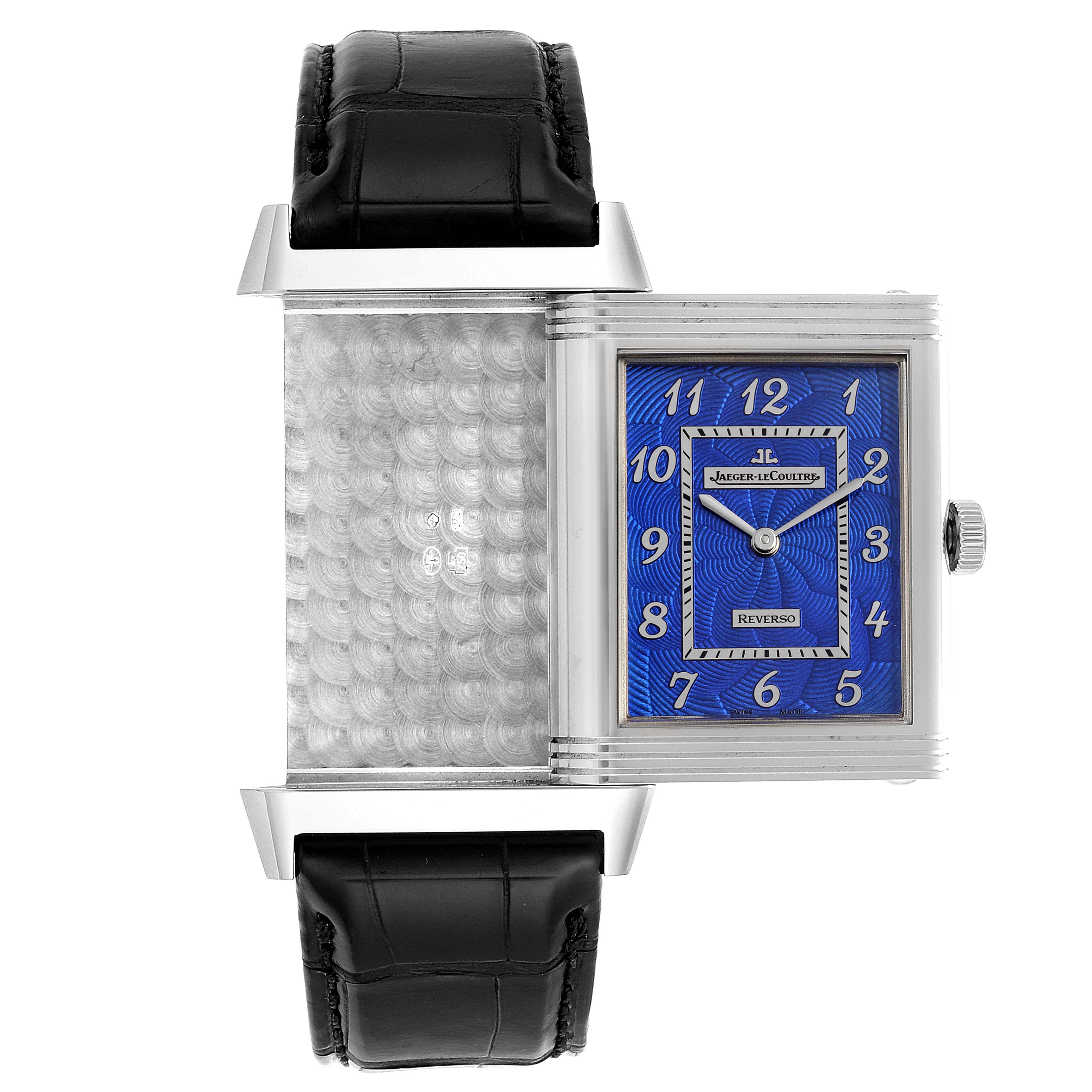 The image shows a Jaeger LeCoultre Reverso Q33735E1 Men's White Gold Blue Dial Q33735E1 Men's White Gold Blue Dial watch in a front angle with its swiveling case partially opened.