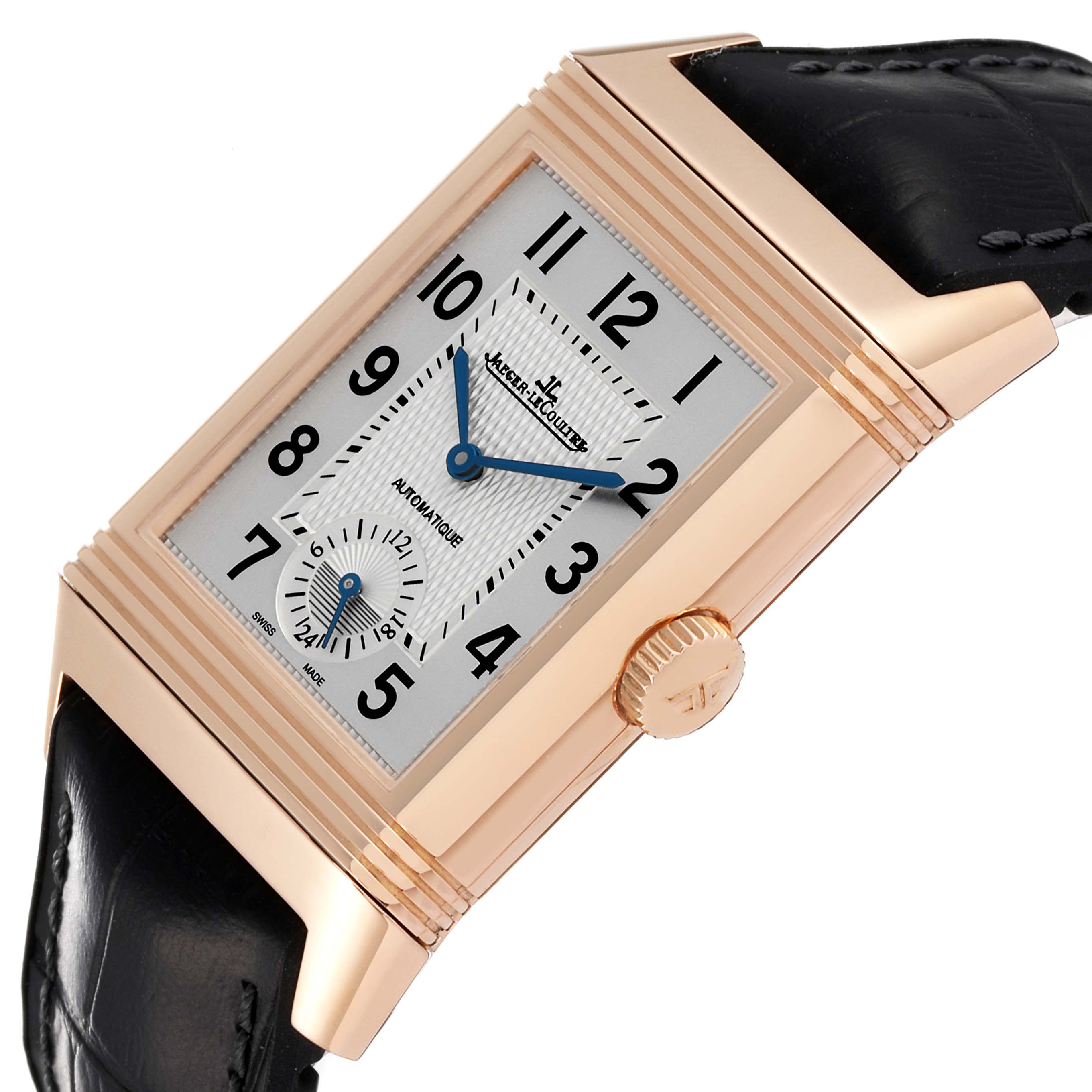 The image shows a close-up of the Jaeger LeCoultre Reverso Q3832420 Men's Rose Gold Silver Dial Q3832420 Men's Rose Gold Silver Dial watch, focusing on the dial, crown, and part of the black leather strap.