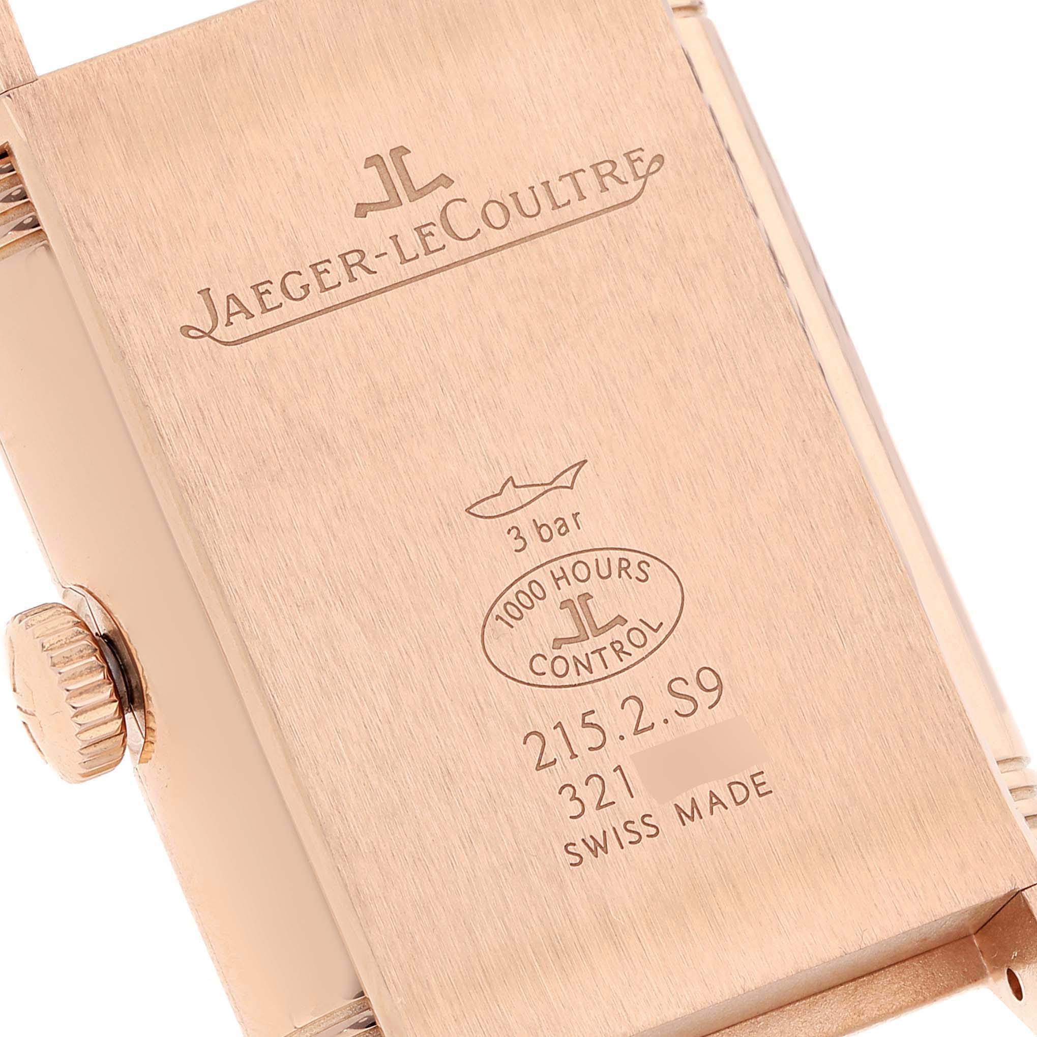 The image shows the back case and crown of a Jaeger-LeCoultre Reverso watch at an angled view.