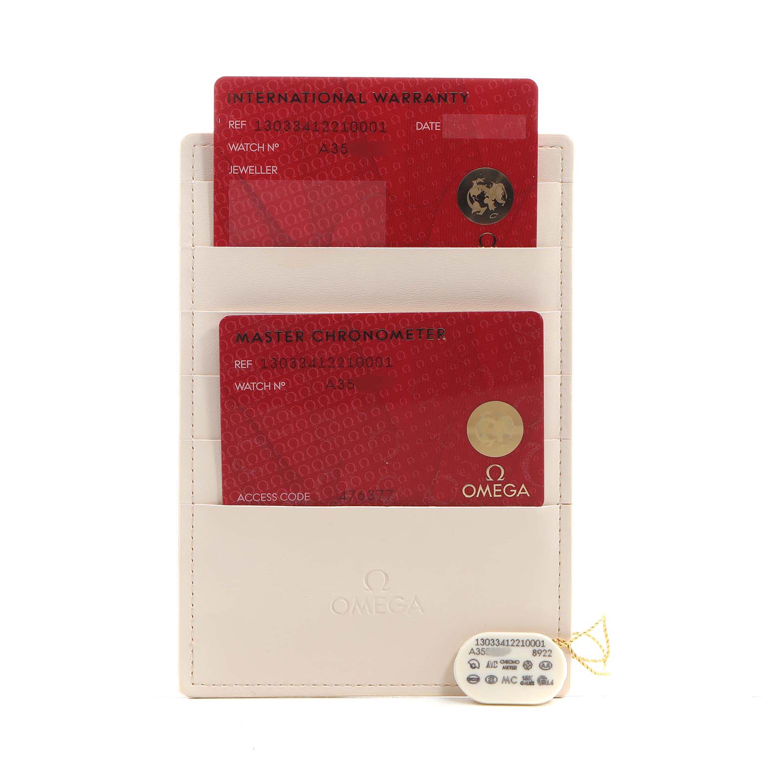 The image shows warranty and chronometer cards for the Omega Constellation 130.33.41.22.10.001 Men's Stainless Steel Green Dial, along with a tag, angled from the front.