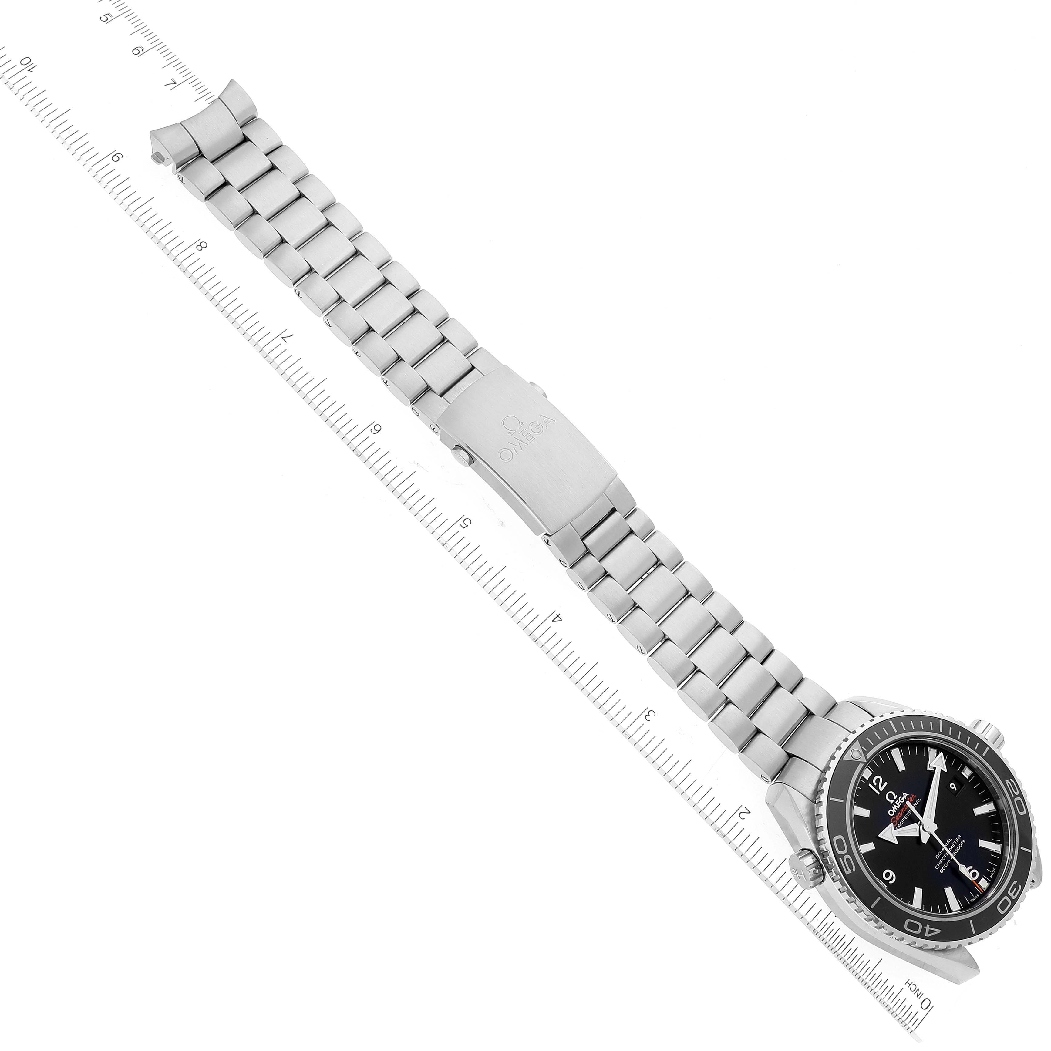 The Omega Planet Ocean 232.30.46.21.01.001 Men's Stainless Steel Black Dial watch is shown from an overhead angle, displaying its face, stainless steel bracelet, and folded clasp.