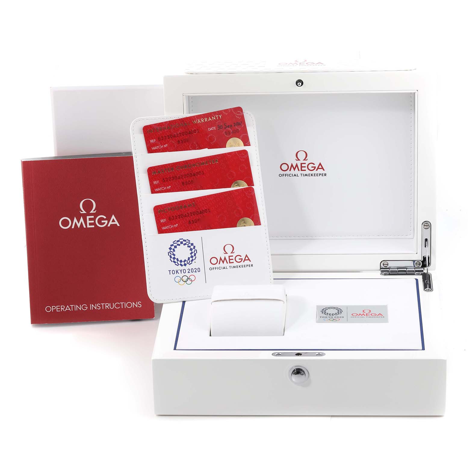 The image shows an Omega Seamaster 522.30.42.20.04.001 Men's Stainless Steel White Dial 522.30.42.20.04.001 Men's Stainless Steel White Dial watch box, warranty cards, operating instructions, and a cushion for the watch.