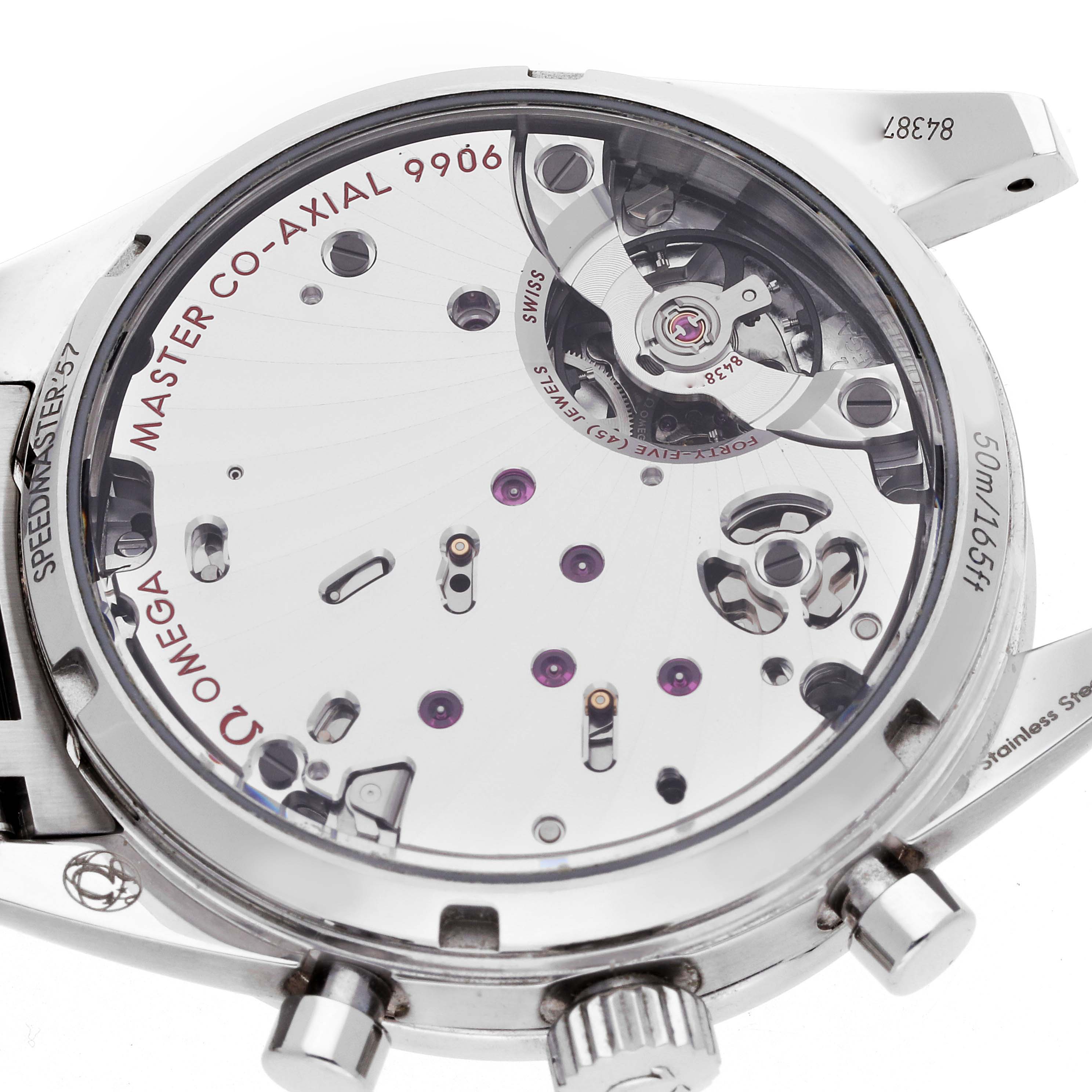 The image shows the back of an Omega Speedmaster 332.10.41.51.03.001 Men's Stainless Steel Blue Dial, revealing the intricate movement and "Master Co-Axial 9906" details.