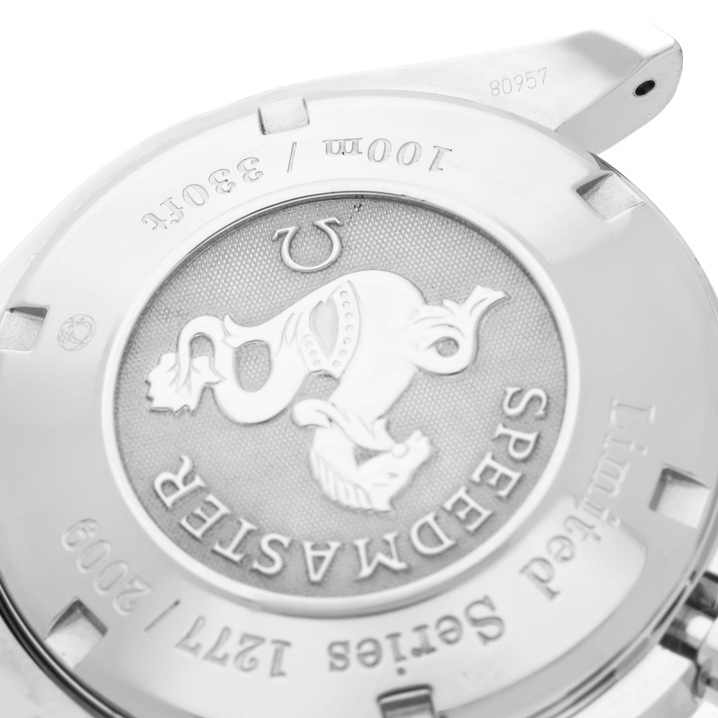 The image shows the case back of an Omega Speedmaster 323.30.40.40.01.001 Men
s Stainless Steel Black Dial 323.30.40.40.01.001 Men
s Stainless Steel Black Dial watch, highlighting its engravings and logo.