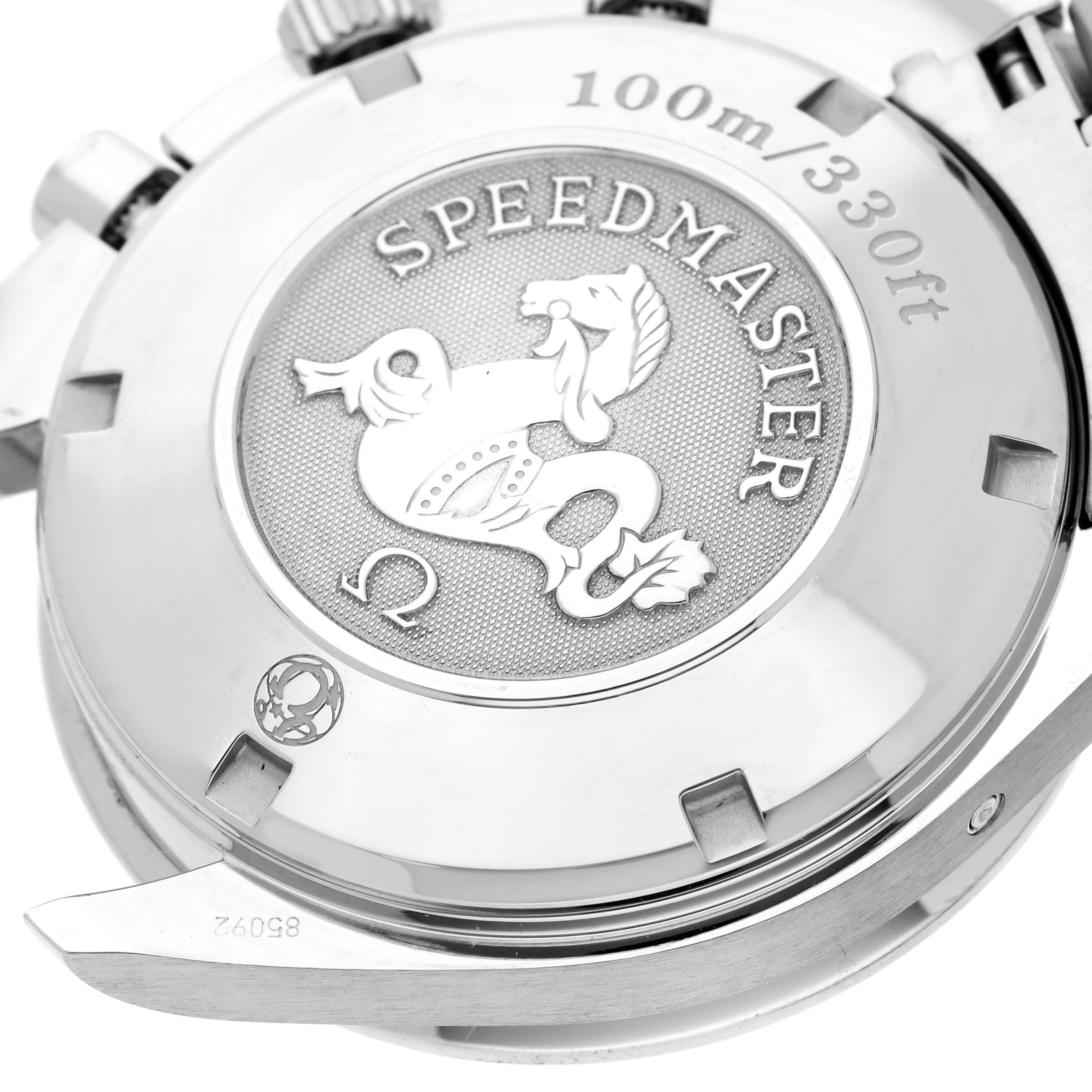 This image shows the back case of an Omega Speedmaster 323.30.40.40.04.001 Men's Stainless Steel White Dial 323.30.40.40.04.001 Men's Stainless Steel White Dial watch, highlighting the engraved logo and 100m/330ft water resistance.