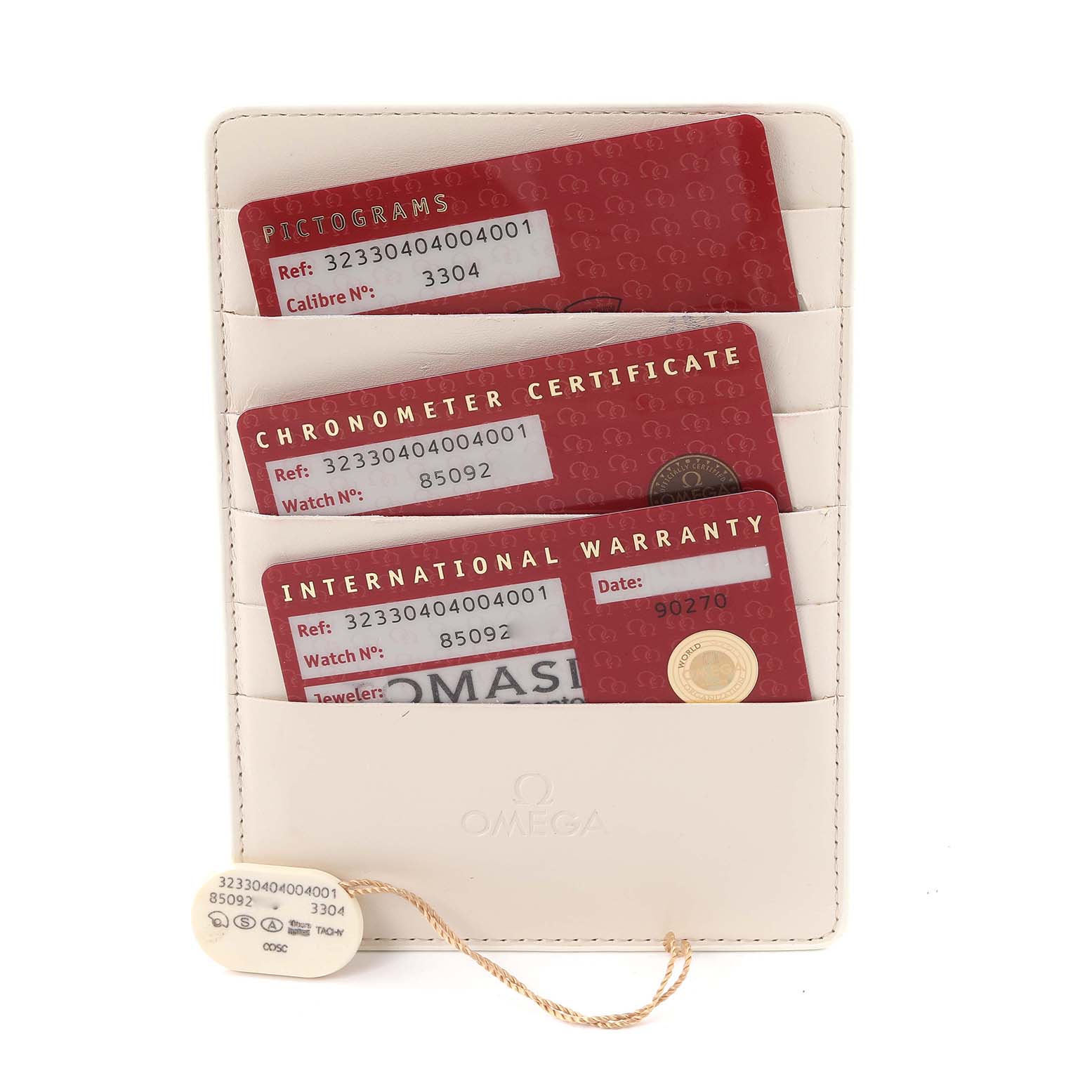 The image shows the warranty cards and certification for an Omega Speedmaster 323.30.40.40.04.001 Men's Stainless Steel White Dial 323.30.40.40.04.001 Men's Stainless Steel White Dial, displayed in a beige cardholder.