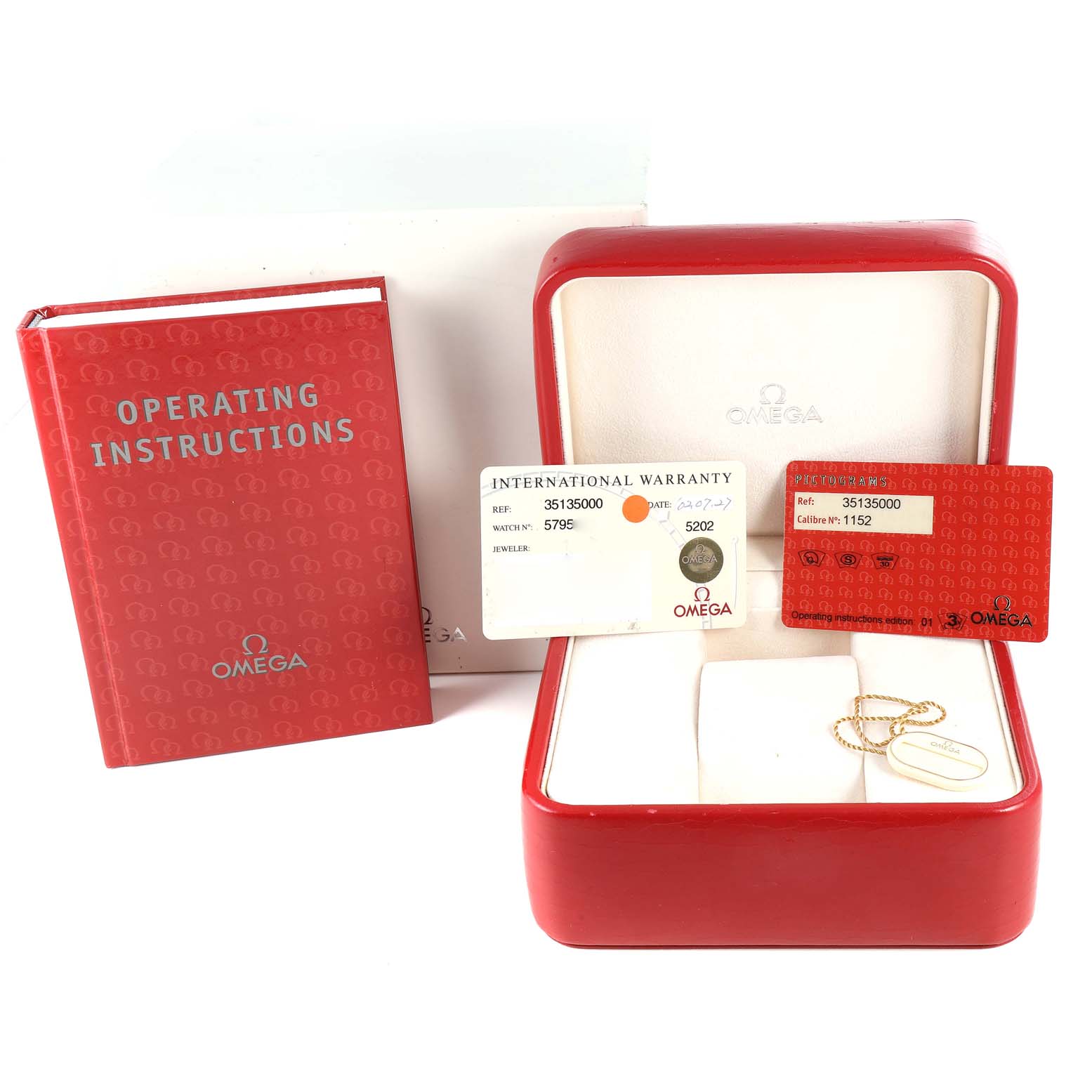 The image shows Omega Speedmaster 3513.50.00 Men's Stainless Steel Black Dial accessories, including an operating manual, warranty cards, and a red watch box.