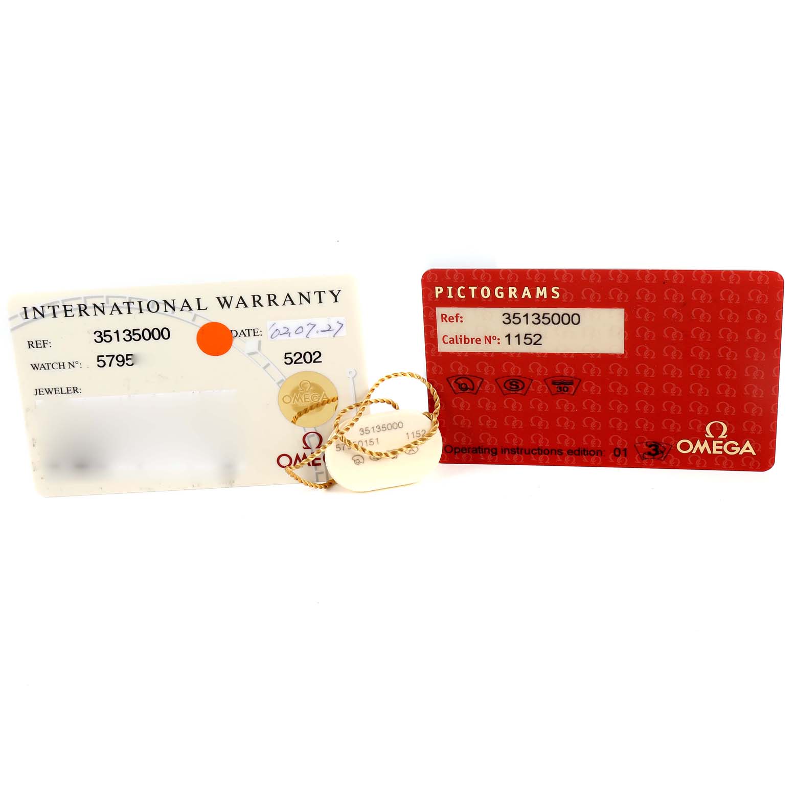 The image shows the warranty and pictogram cards for the Omega Speedmaster 3513.50.00 Men's Stainless Steel Black Dial model.