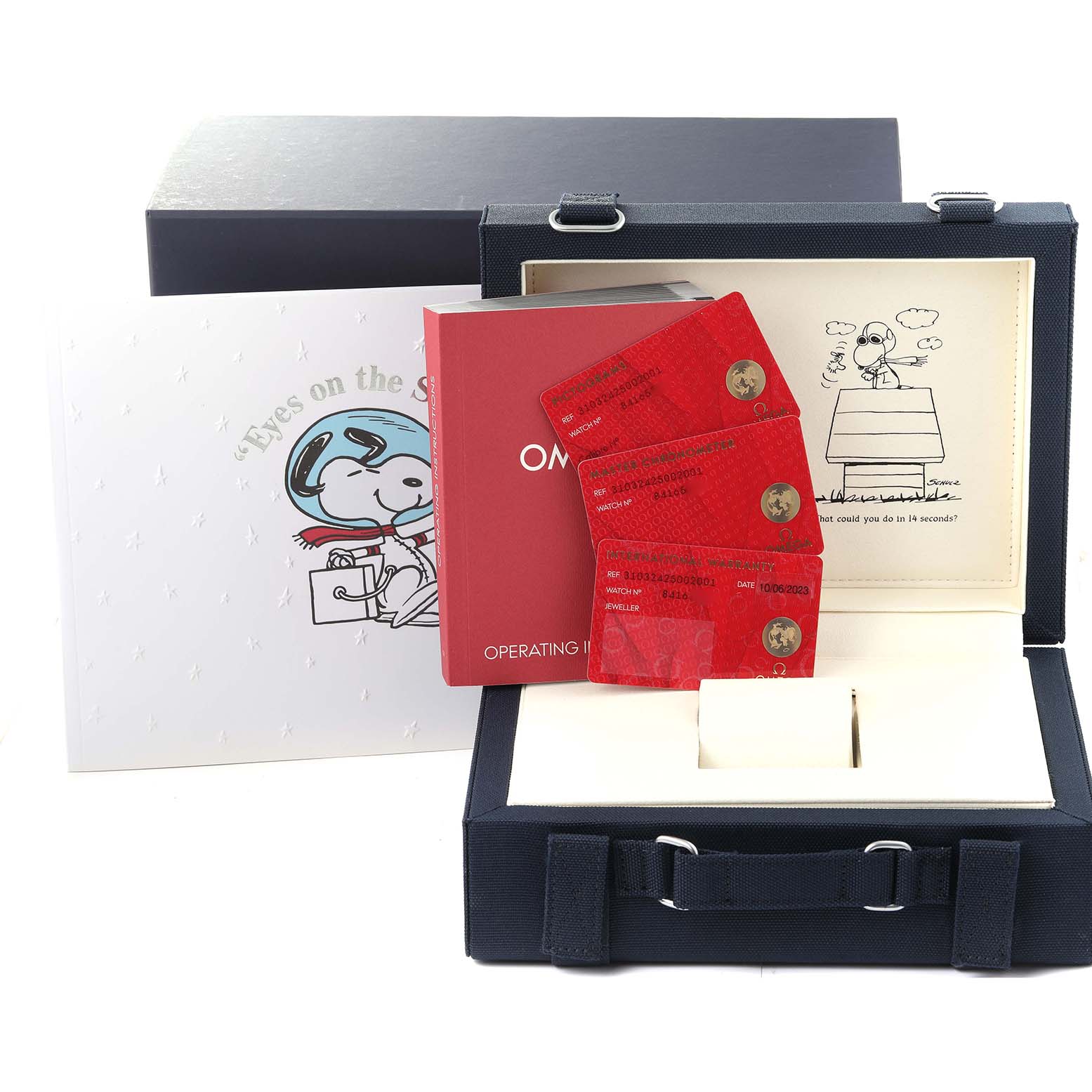 The image shows the packaging, operating instructions, warranty cards, and accessories for an Omega Speedmaster 310.32.42.50.02.001 Men
s Stainless Steel Silver Dial 310.32.42.50.02.001 Men
s Stainless Steel Silver Dial watch, including a Snoopy-themed booklet.