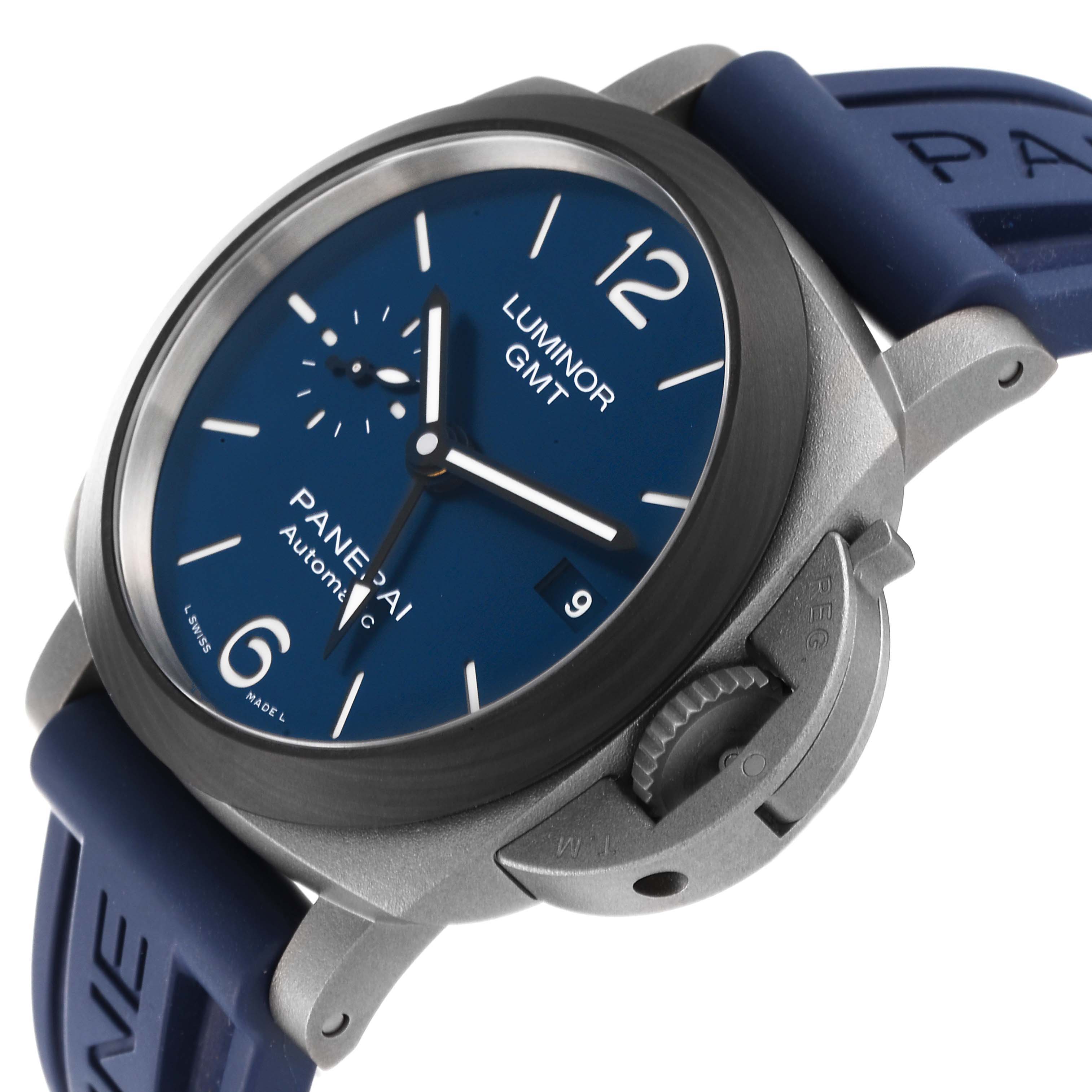The image shows a Panerai Luminor PAM01279 Men's Titanium Blue Dial PAM01279 Men's Titanium Blue Dial GMT watch from a front angle, highlighting the blue dial, crown guard, and blue strap.