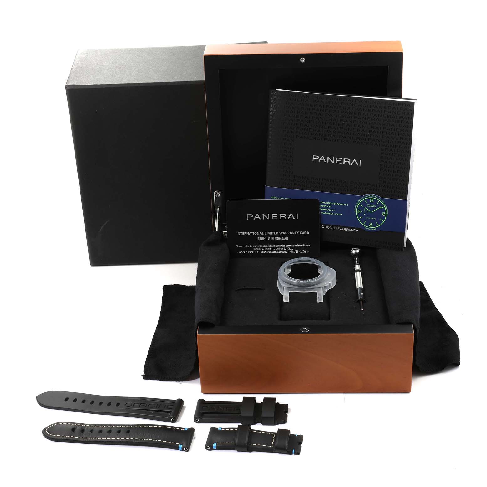 The image shows a Panerai Luminor PAM00796 Men
s Stainless Steel Black Dial PAM00796 Men
s Stainless Steel Black Dial watch set with additional straps, a screwdriver, documentation, and packaging from a top-down angle.