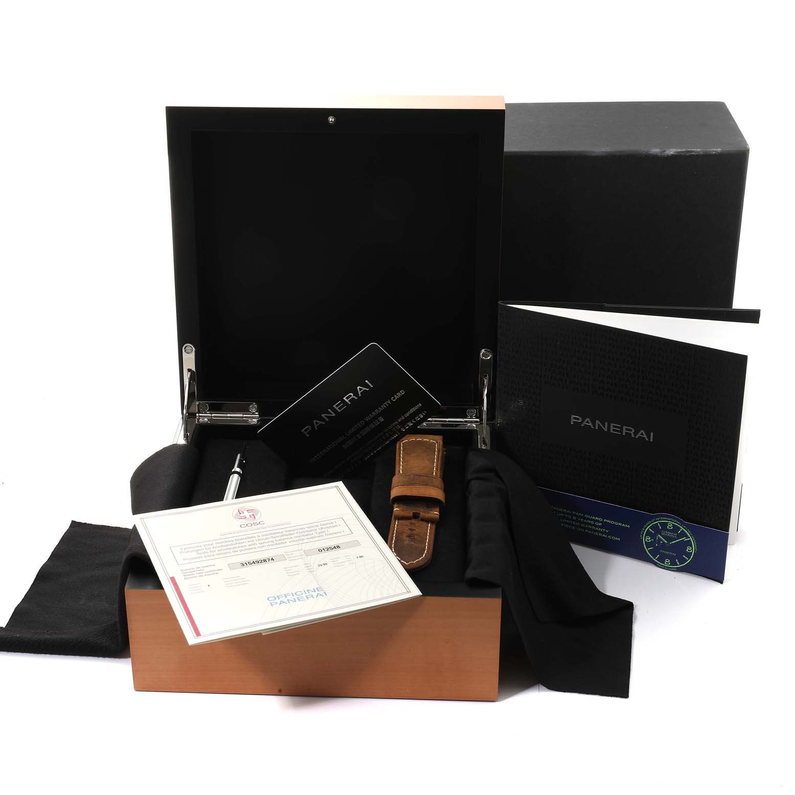 The image shows a Panerai Luminor PAM01104 Men
s Stainless Steel Black Dial PAM01104 Men
s Stainless Steel Black Dial watch box set with accessories, including a leather strap, manuals, and warranty cards.