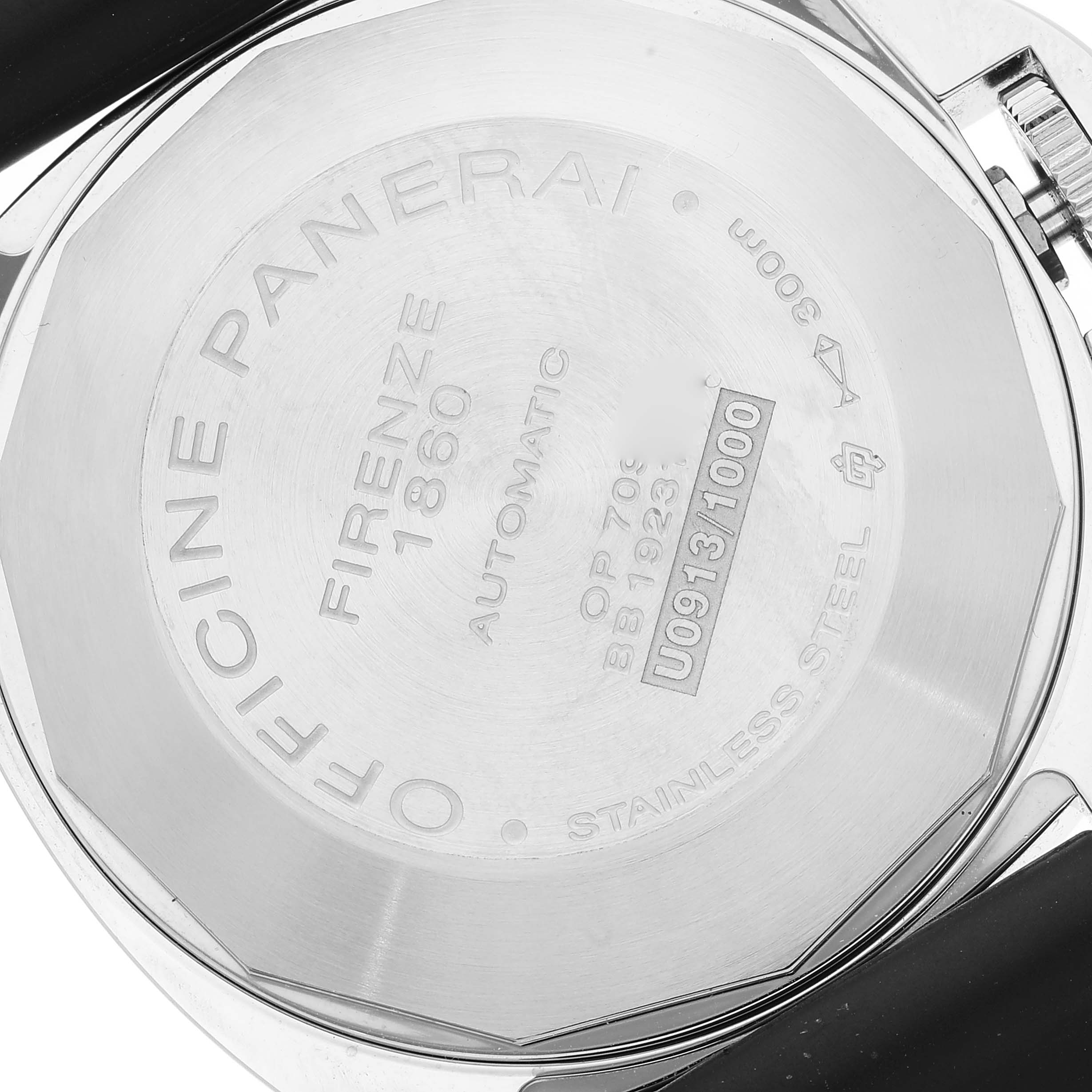 The image shows the back case of a Panerai Luminor PAM01104 Men
s Stainless Steel Black Dial PAM01104 Men
s Stainless Steel Black Dial watch at an angle that highlights its inscriptions.