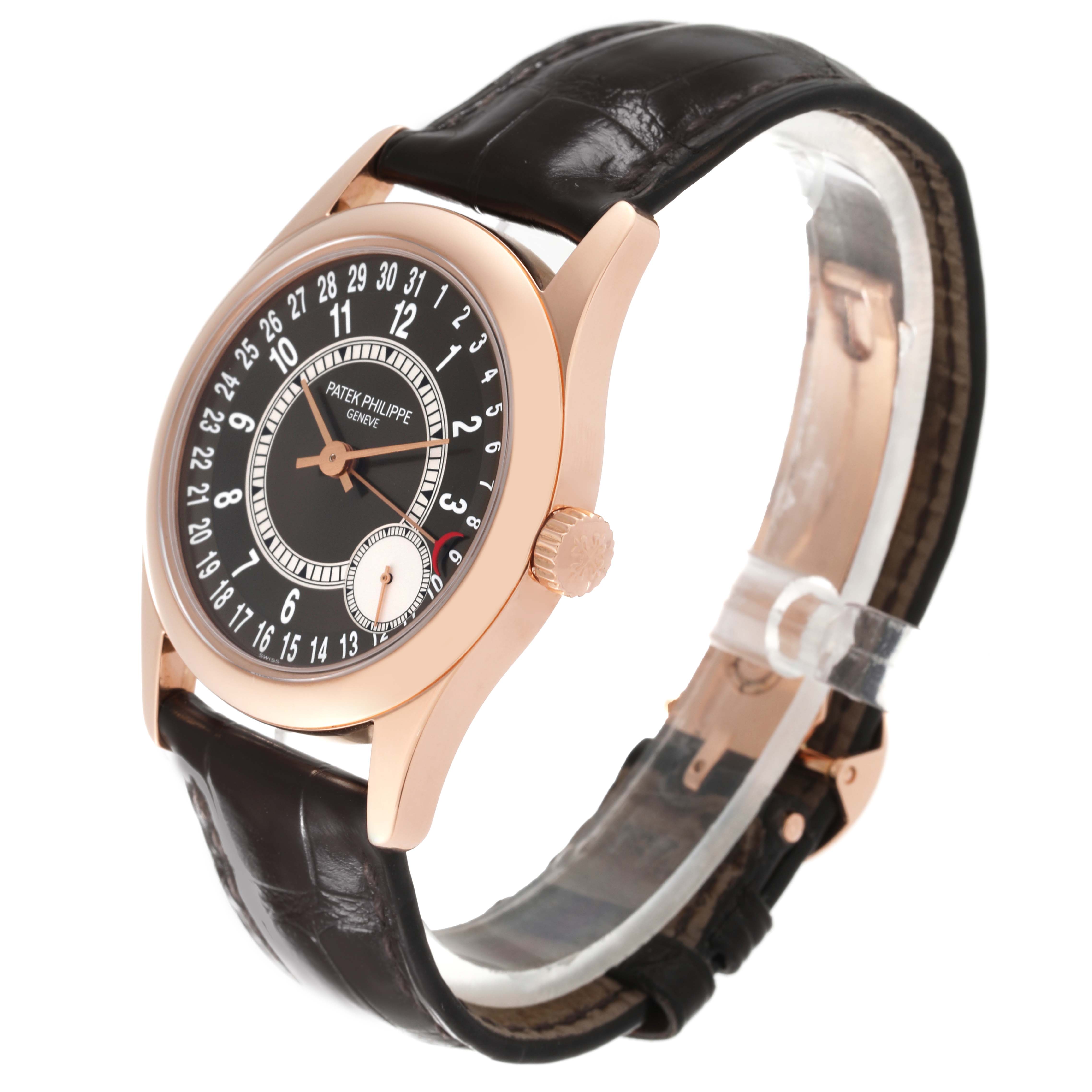 The image shows a Patek Philippe Calatrava 6000R-001 Men's Rose Gold Brown Dial 6000R-001 Men's Rose Gold Brown Dial watch at an angle highlighting its face, crown, and leather strap.